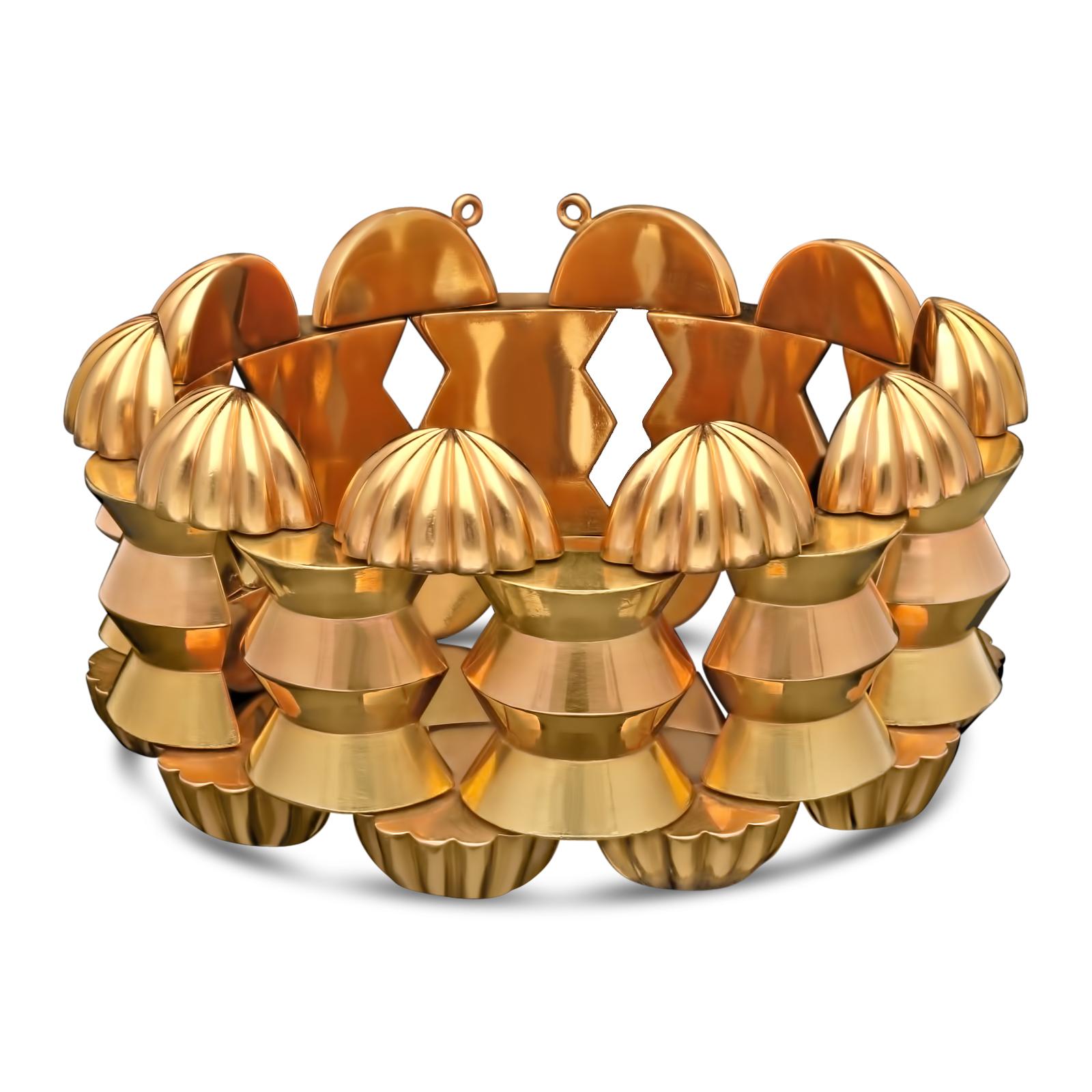 A bold and stylish two-tone gold Retro bracelet c.1940s designed as a wide band of 18ct yellow and rose gold geometric domed links borded each side by a row of rose gold half-dome fluted shell-like links, to a concealed tongue and box clasp.

21cm