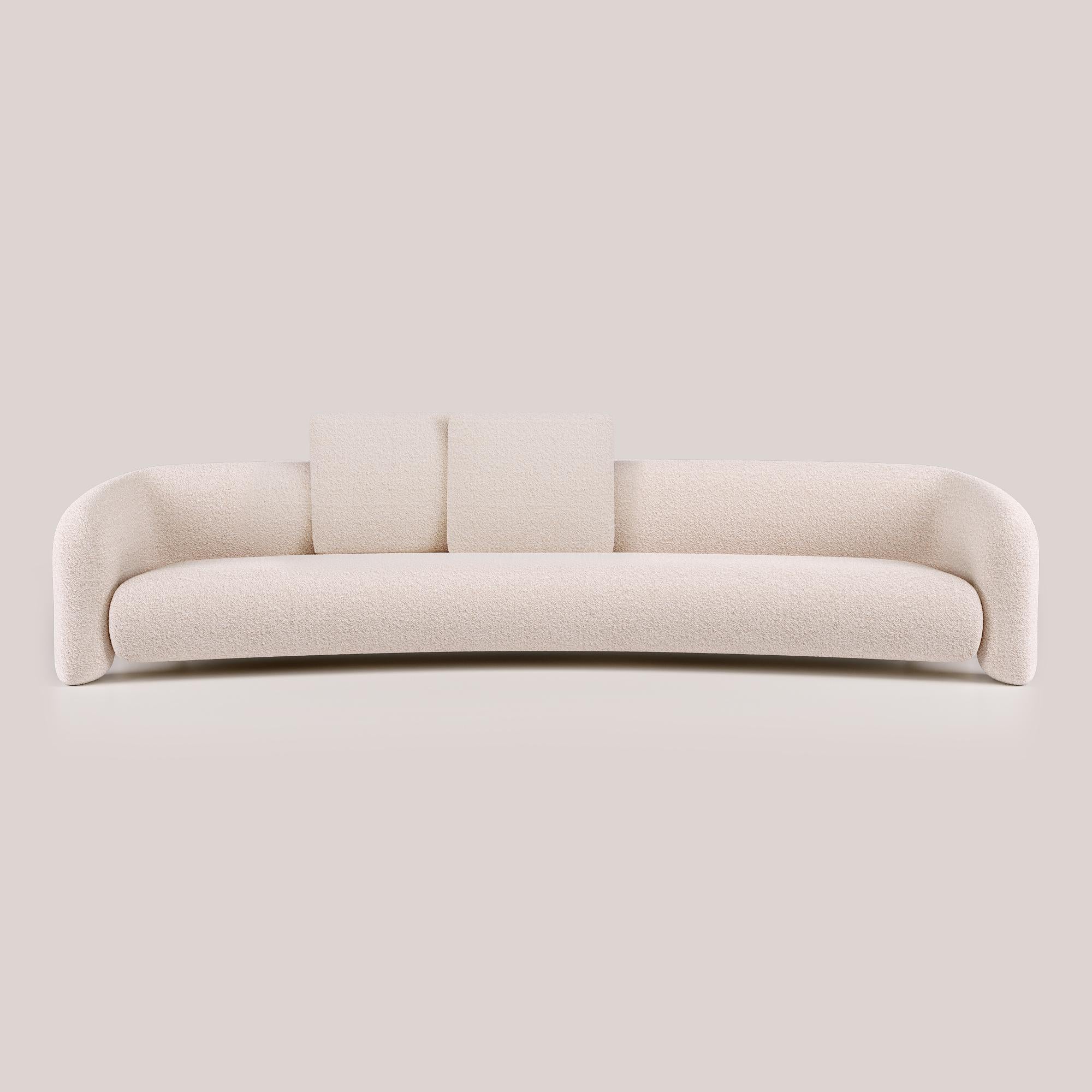With its contemporary design, this version of the Bold Sofa Curved introduces new dimensions of comfort, offering expanded space for ultimate relaxation. The fluid lines and organic curves, combined with its open arms feature, further amplify the