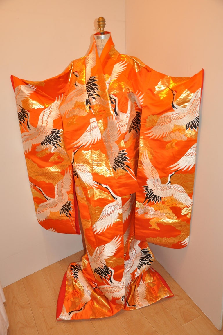      This wonderfully bold tangerine ceremonial detailed embroidered silk kimono detailed flock of 
