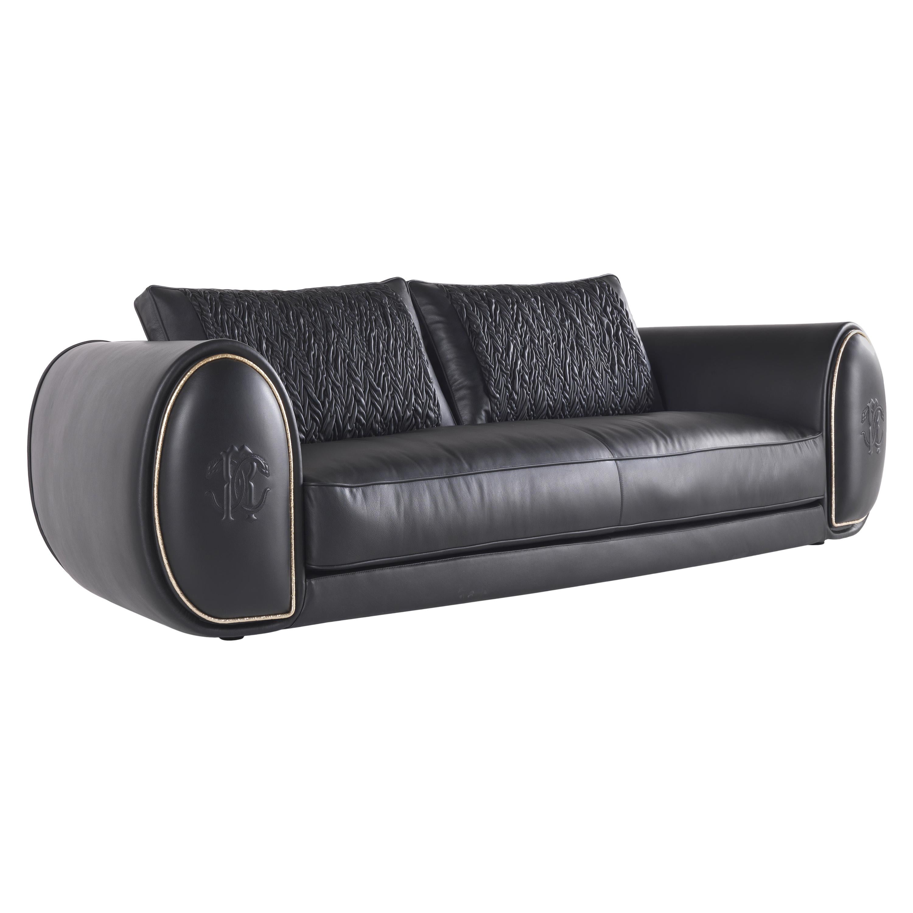 Bold.2 3-seater sofa structure in poplar wood, foam and feather. Upholstery in leather CAT. B Touch COL. Black With “Spiga’’ Quilting on back structural cushions. Metal details in brass glossy gold finishing. Stitched RC Snake logo on armrests.