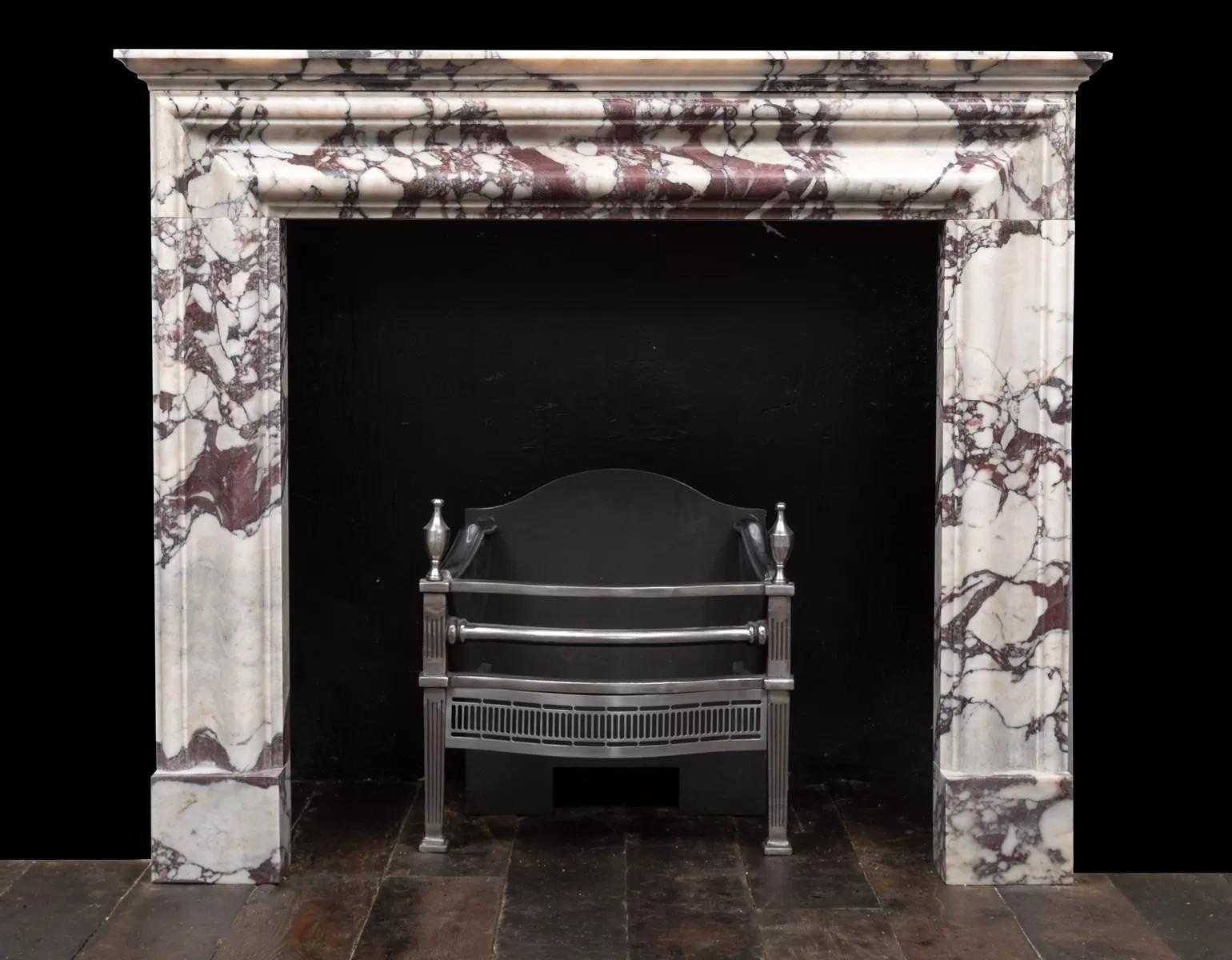 Northern Irish bolection fireplace produced in Italian Breccia Viola marble by Ryan & Smith For Sale