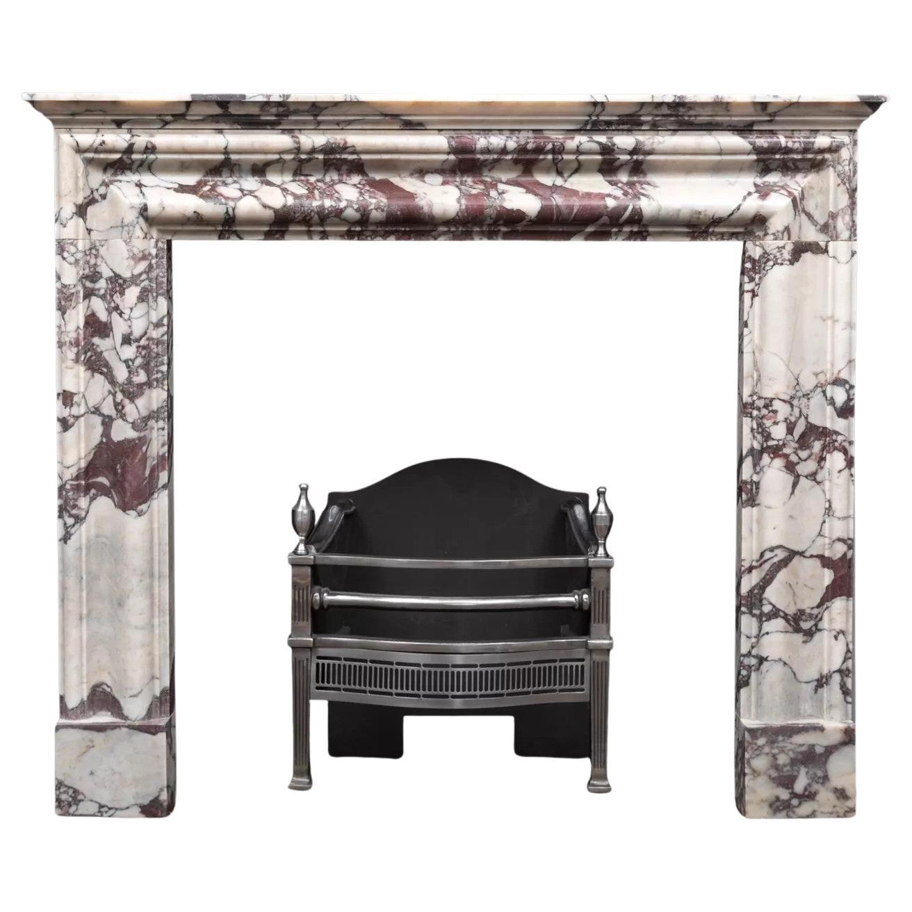 bolection fireplace produced in Italian Breccia Viola marble by Ryan & Smith For Sale