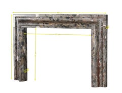 Bolection Fireplace Surround In Marble With Black Accents