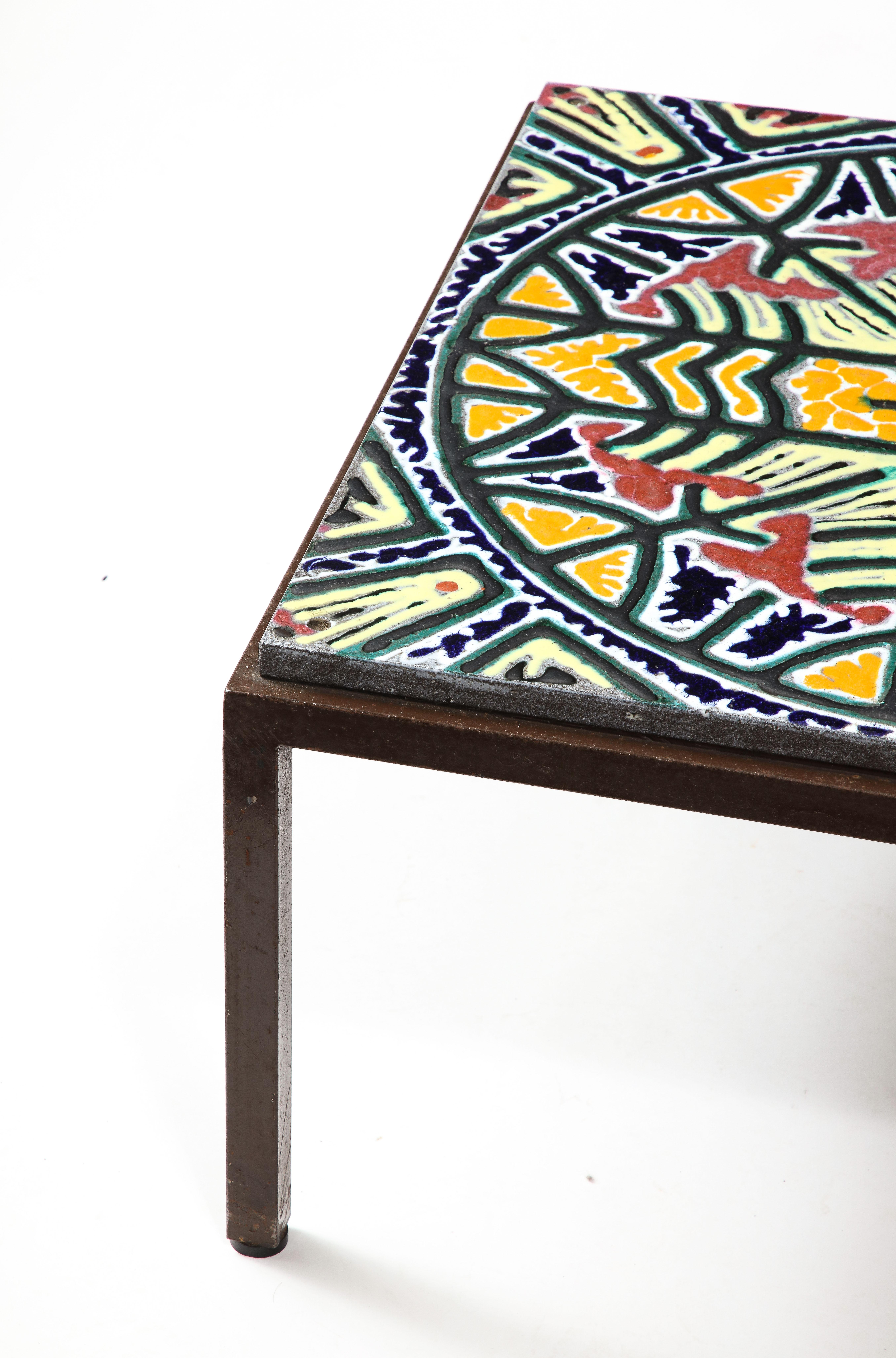 Rare coffee table by the ceramist of Guillerme & Chambon, Boleslaw Danikowski. Made of a slab of natural lava stone enameled in various colors and patterns then kiln fired.