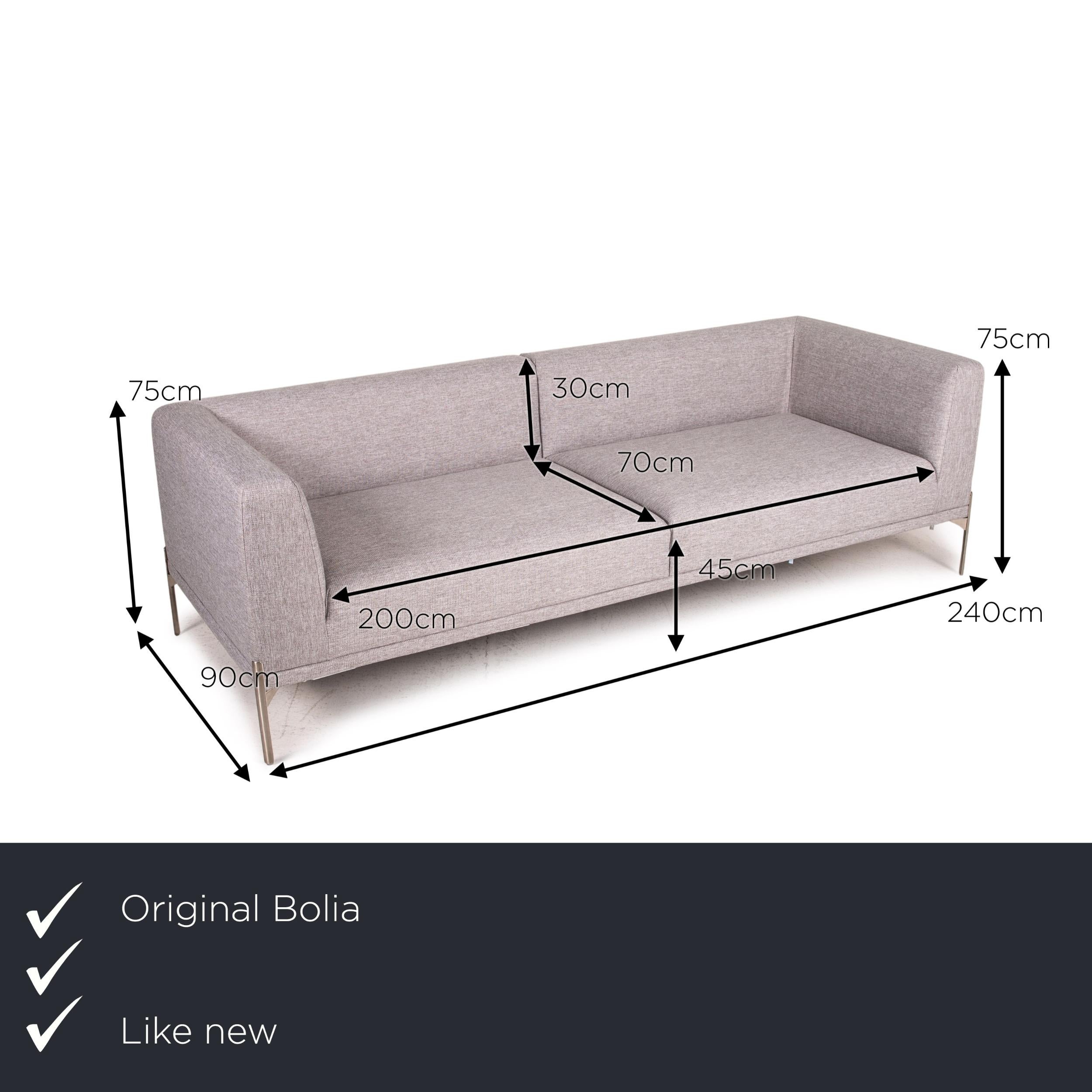 We present to you a Bolia Caisa fabric sofa gray light gray three-seater couch.


 Product measurements in centimeters:
 

Depth: 90
Width: 240
Height: 75
Seat height: 45
Rest height: 75
Seat depth: 70
Seat width: 200
Back height: 30.
 