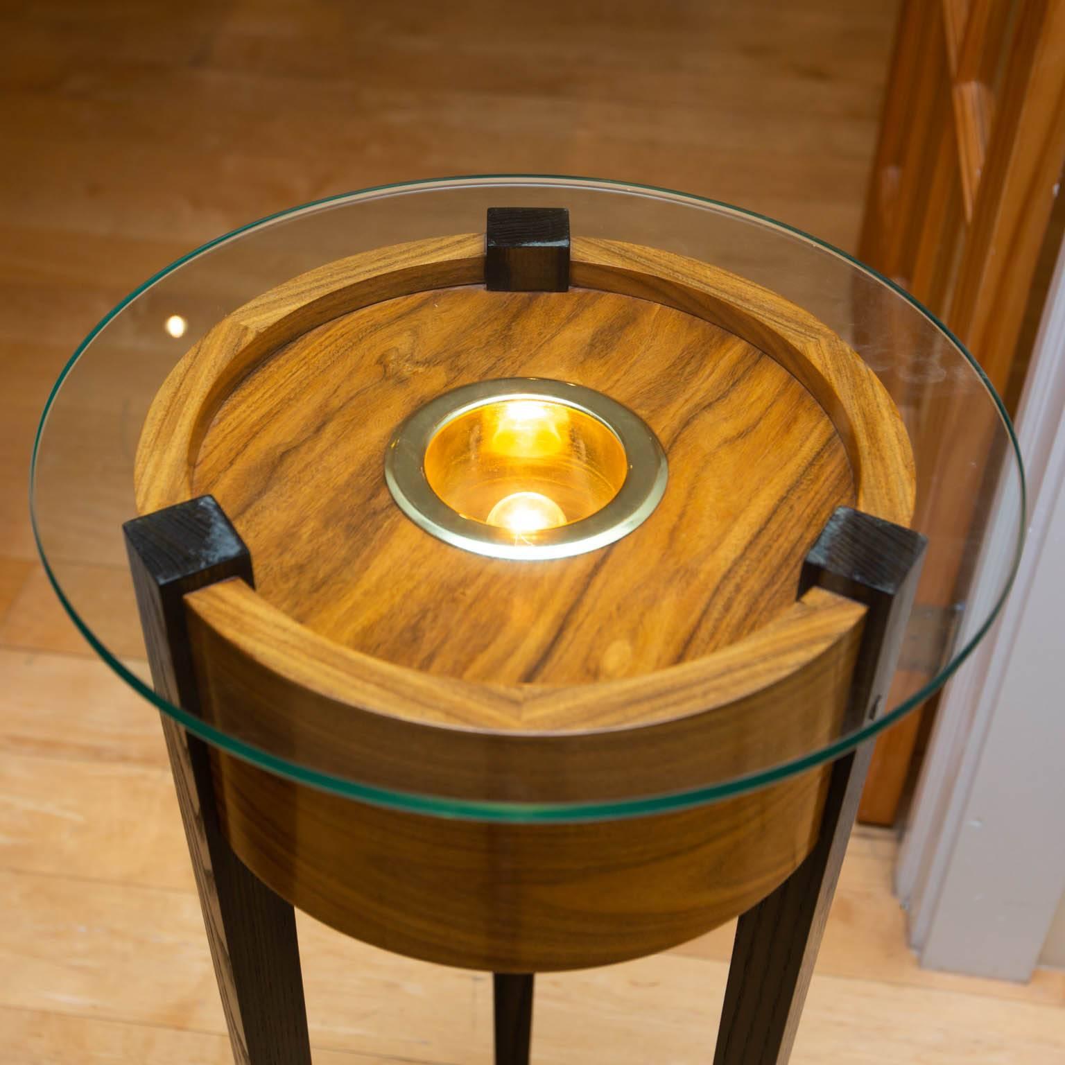 Bolivian rosewood with ebonized legs featuring an integrated LED light.