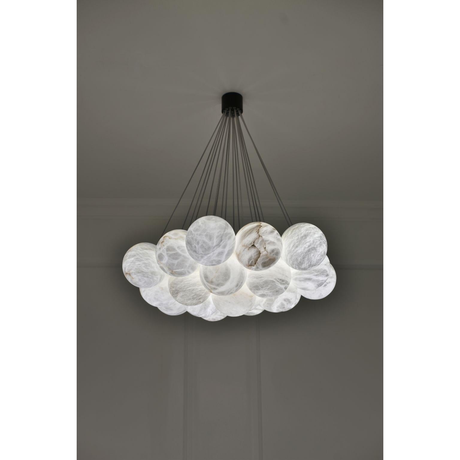 Bolky chandelier by Atelier Alain Ellouz
Atelier Alain Ellouz 
Dimensions: Ø 29.5 in x h. m in 23.6 in - max.47.2 in
Materials: 19 Alabaster spheres Ø5,9’’, 
Weight: 55 lb

Suspension system: Stainless steel wire rope + transparent electrical cable

