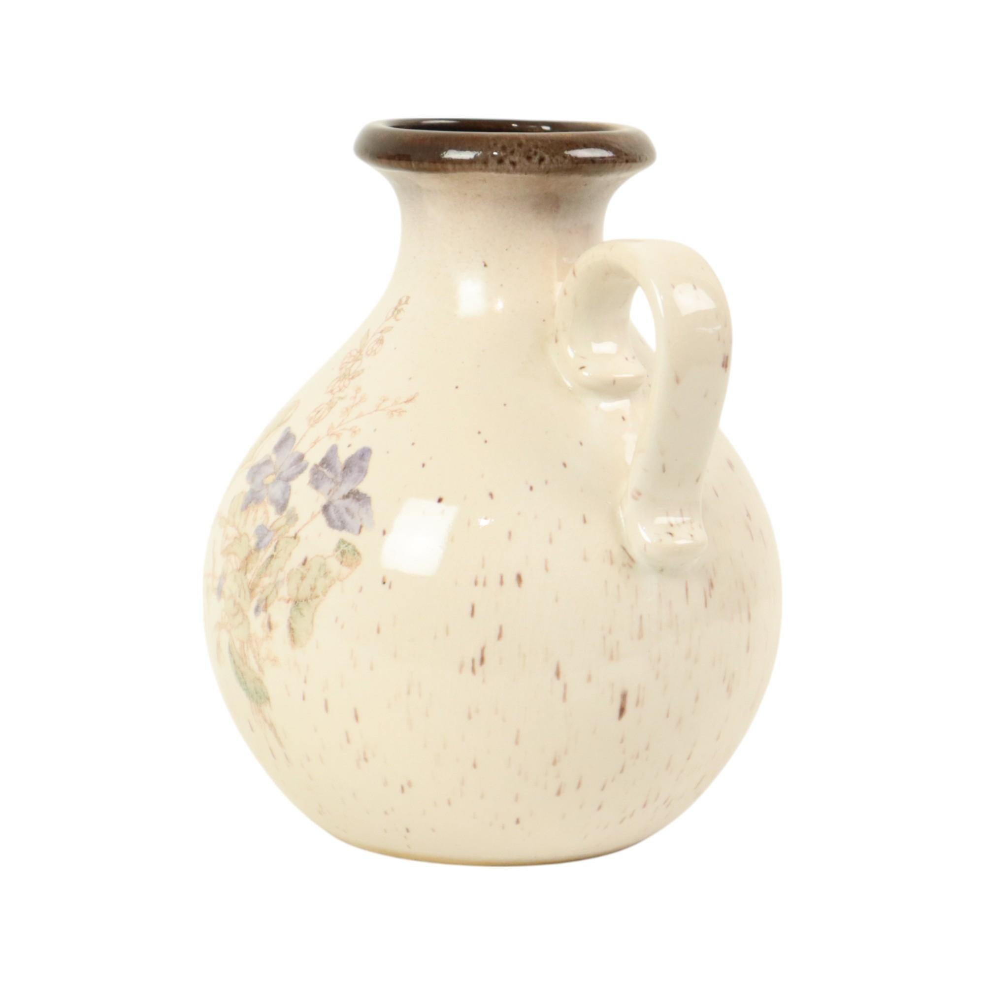 Vintage minimalist and convex West Germany vase by Scheurich, circa 1960s, numbered 495-20 at the bottom.

This mid century modern vase is glazed and has a central floral decoration, it has brown speckles on a white background.

West Germany was