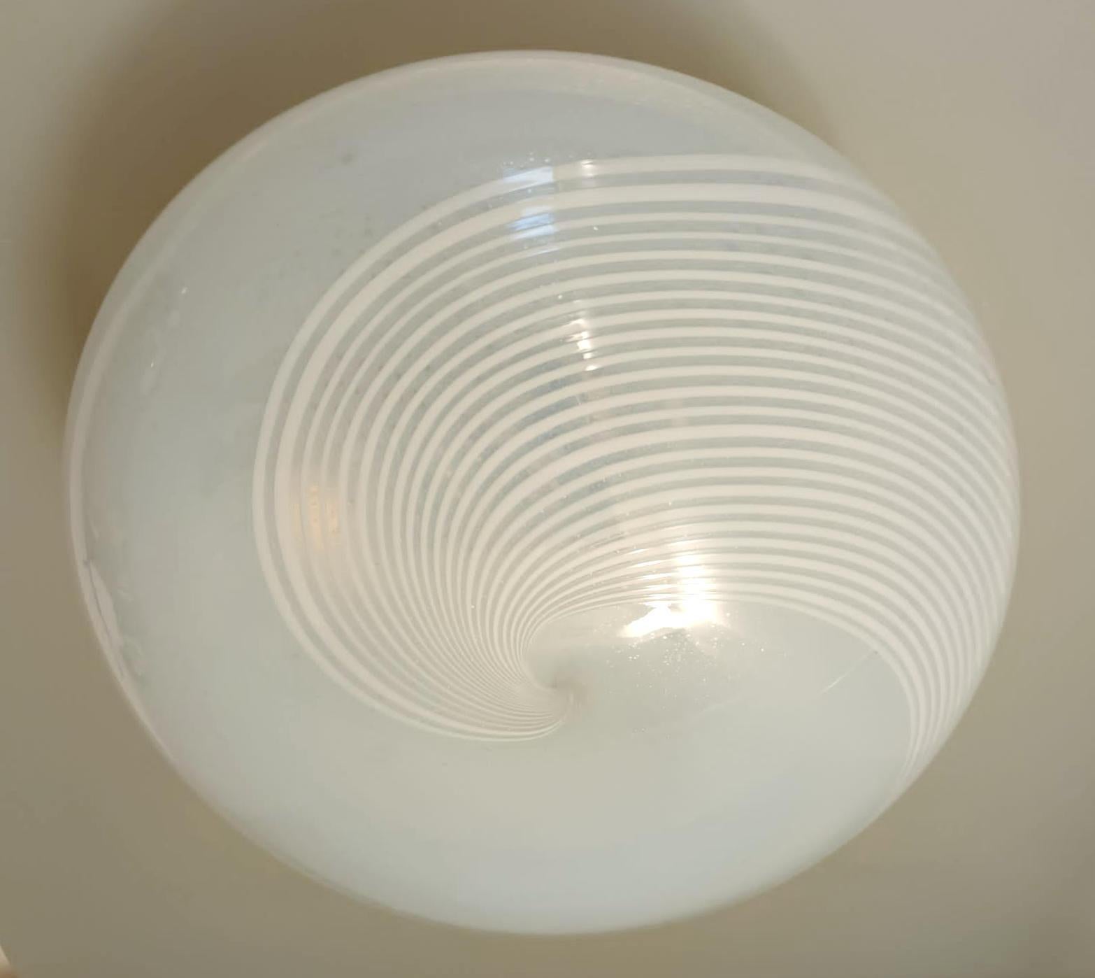 Vintage Italian flush mount or wall light with a single frosted white Murano glass shade hand blown with bubbles, decorated with milky white ribbed spiral pattern / Made in Italy circa 1960s
Original label on the frame
Measures: diameter 17.5