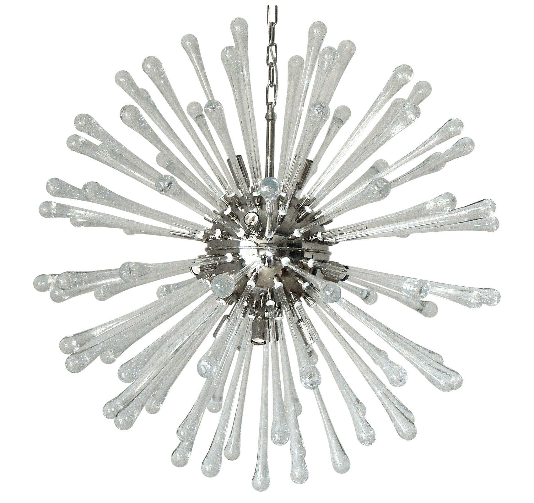 Italian modern Sputnik chandelier with clear drop shaped Murano glasses hand blown with bubbles within the glass in Bollicine technique, mounted on chrome frame / designed by Fabio Bergomi for Fabio Ltd / made in Italy
16-light / E12 or E14 type /