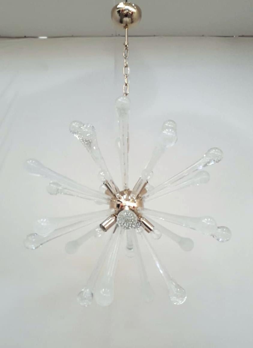 Italian modern sputnik chandelier shown in mixture of vintage clear and frosted Murano glass drops hand blown with bubbles inside the glass using Bollicine technique, mounted on newly made gold finish metal frame / Made in Italy
Measures: diameter