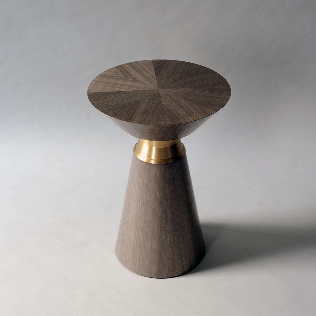 Bolo side table by DeMuro Das 
Dimensions: 35 x H 50 cm
Materials: Koto (Grey) - Matte
 Solid bronze - Satin
 
Dimensions and finishes can be customized.

DeMuro Das is an international design firm and the aesthetic and cultural coalescence