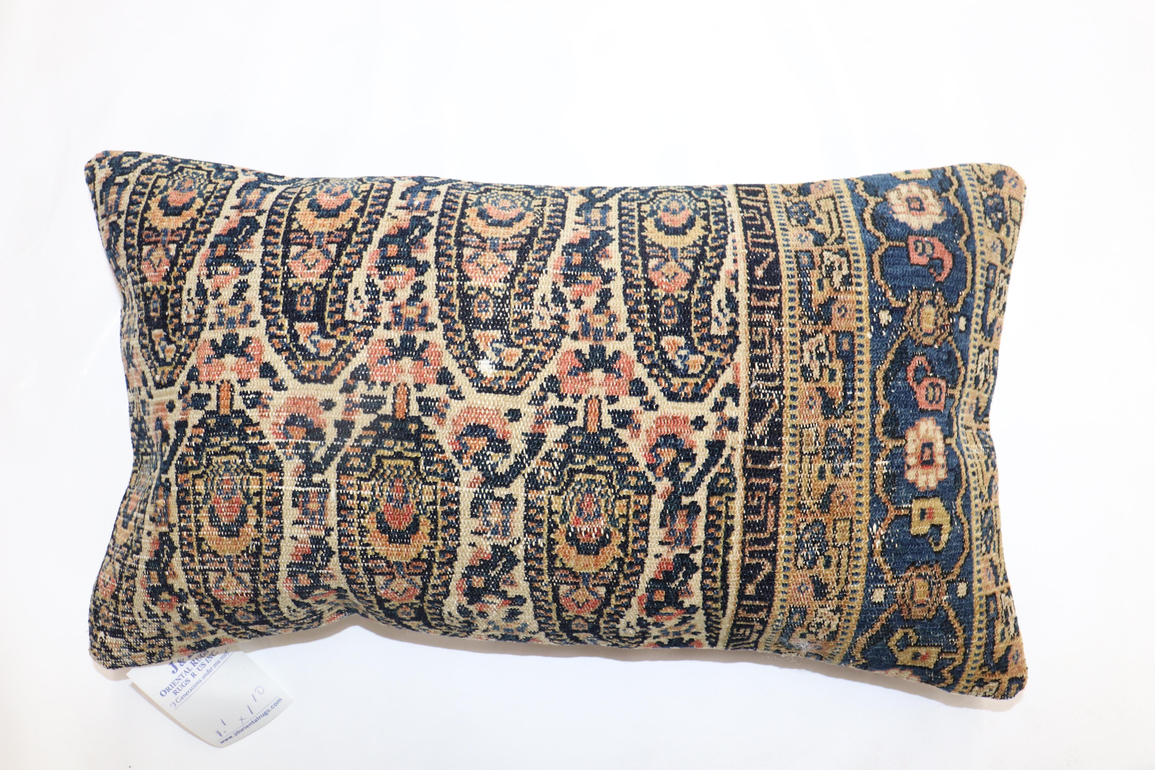 Pillow made from a finely woven Persian Senneh rug.

Measures: 13'' x 22''.