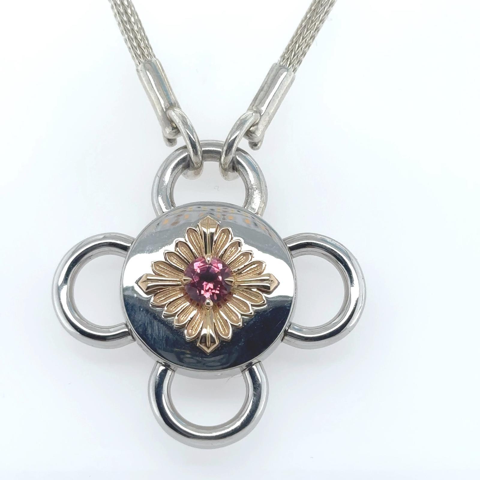 Bolt necklace is transformed around antique gemstones. Inspired by 19th-century archives, it brings new life to the Rosace medallion invented by Léon Rouvenat.

Here, Bolt necklace highlights a pink tourmaline. The polished rose gold center flower