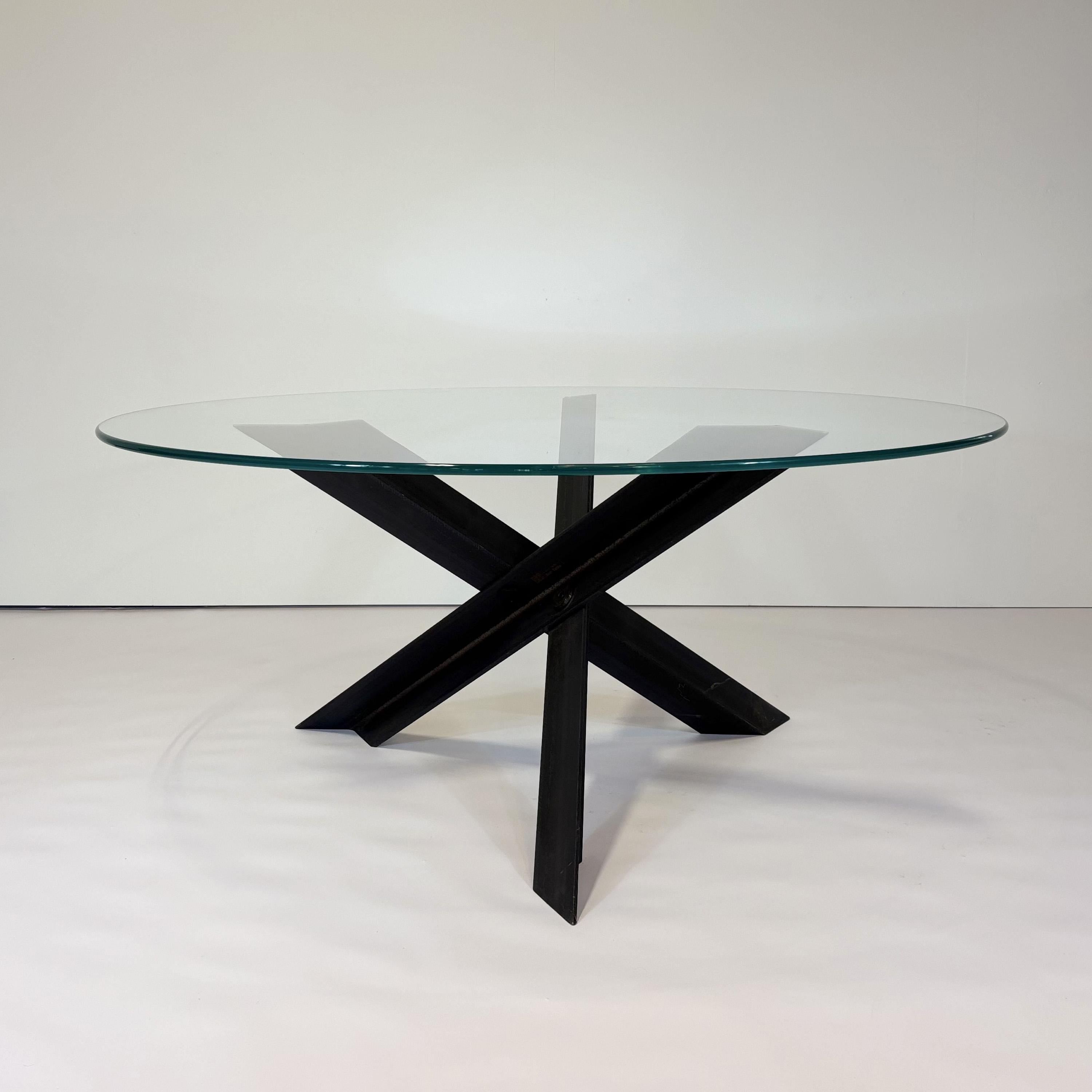 Bolt Table by Mario Bellini
2014 / 2017
B&B Italia

After experimenting with the wooden beams for table bases, Bellini chose to use steel beams for the Bolt Table designed for B&B Italia in 2014. Three intersecting beams are bolted together creating