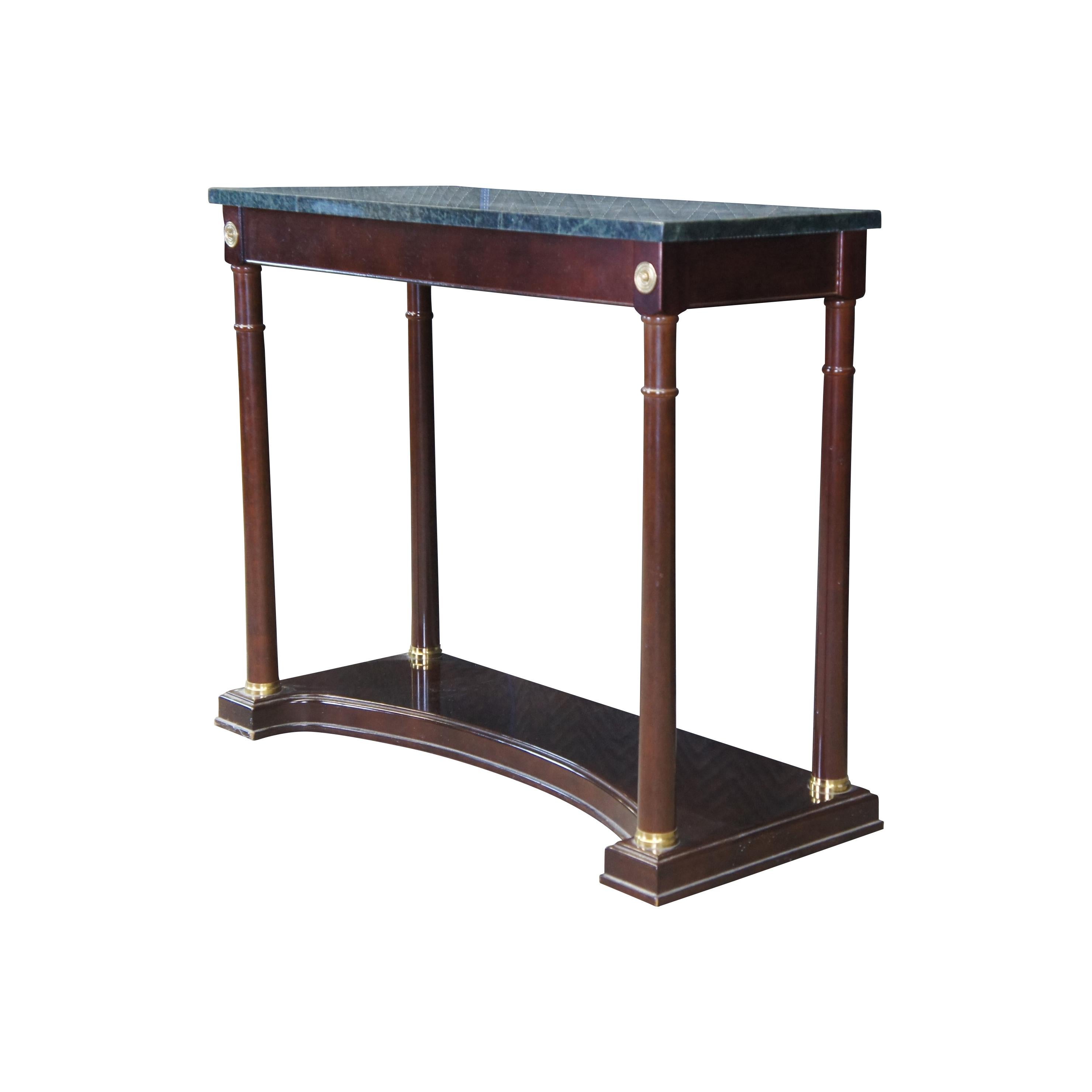 A stunning neoclassical inspired console table by Bombay Company. Made from Mahogany with a green marble top and brass accents. Circa 1989.