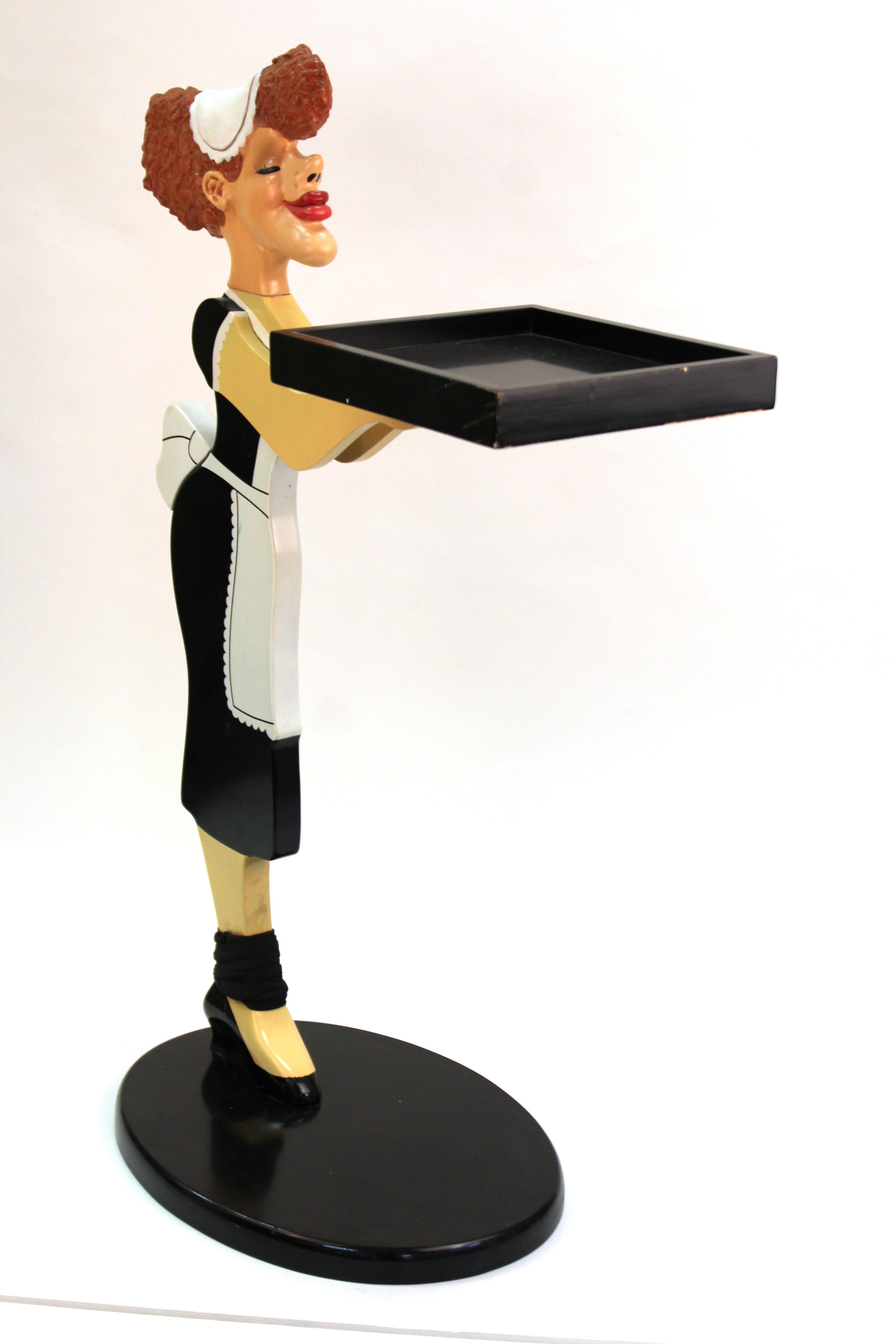 Bombay Company decorative serving stand or tray in shape of a carved wood serving maid. The piece was made by the Bombay Company during the 1980s and is in good vintage condition with age-appropriate wear to the surfaces.