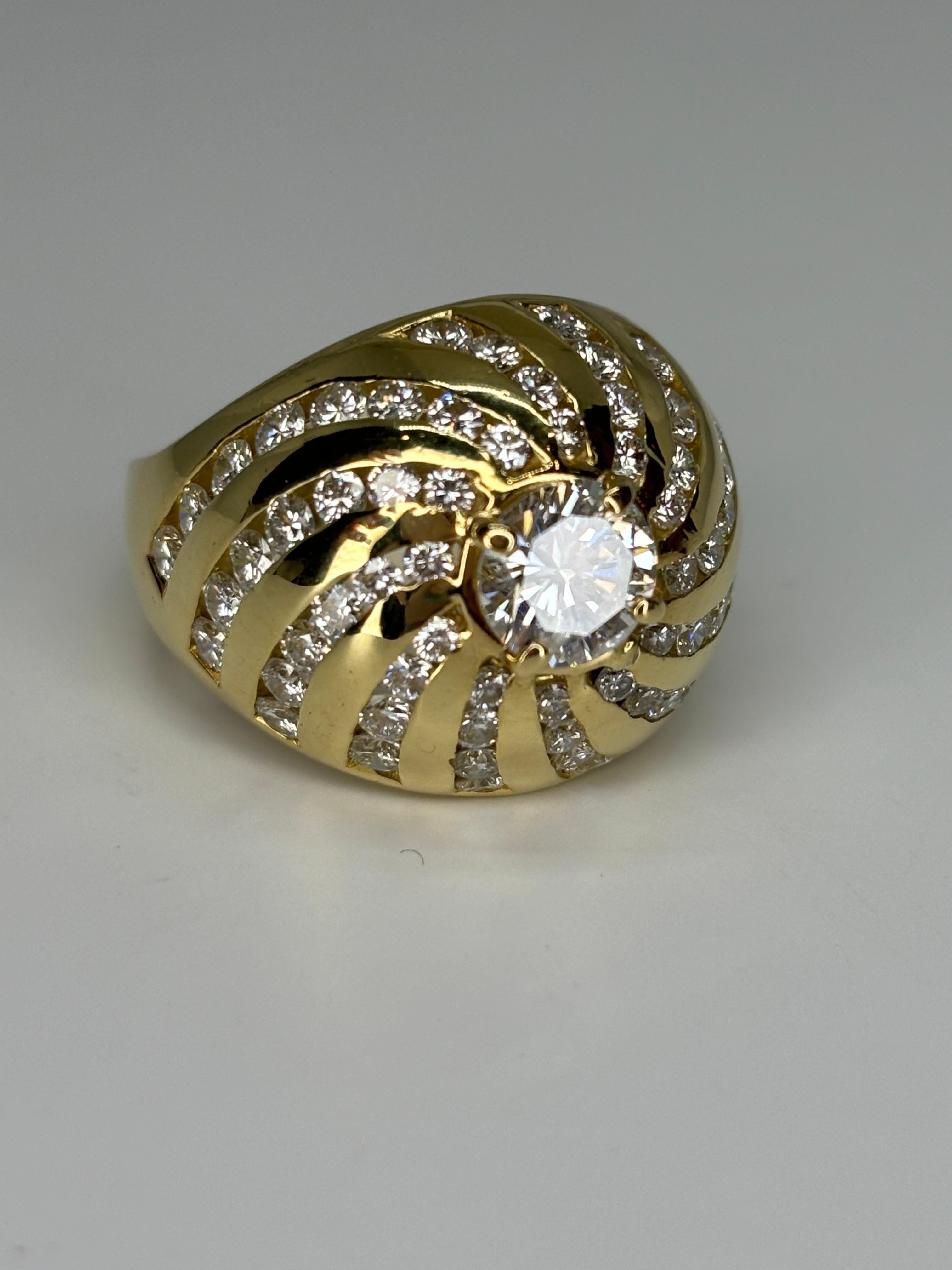 An 18k yellow gold Bombe diamond ring, often styled as a cocktail ring due to its bold and ornate design, makes a luxurious and eye-catching piece of jewelry. 

The term 