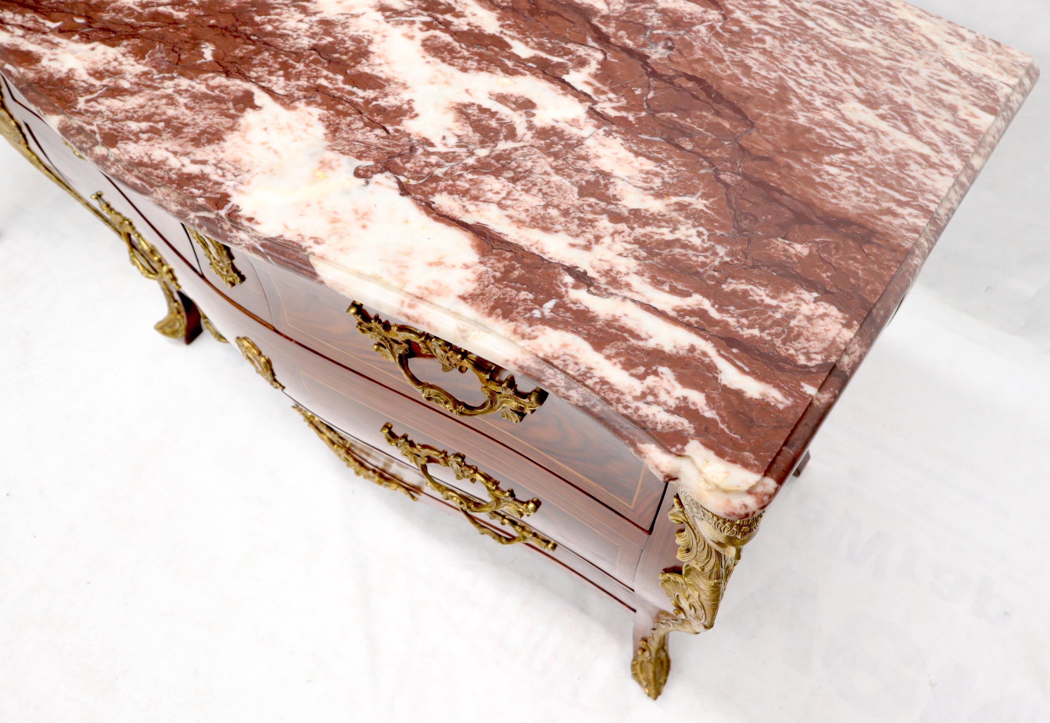 Stunning rouge marble top French inlayed wood dresser with significant bronze ormolu. Very nice decorative piece.