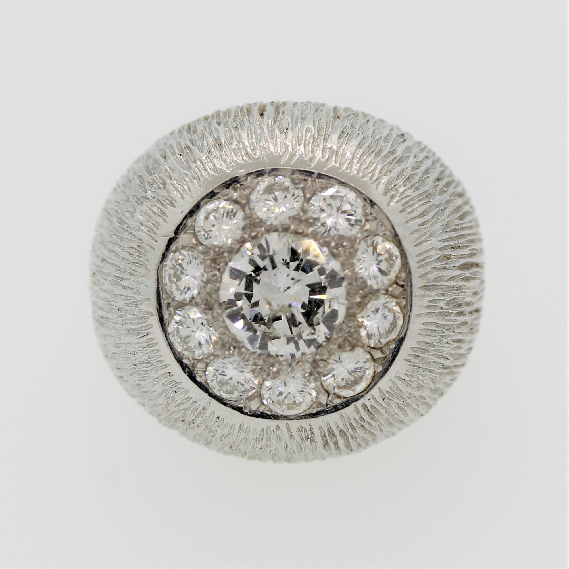 A classic domed ring featuring a center diamond weighing approximately 1 carat. It is haloed by an additional 1 carat of diamonds making the center diamond appear larger. Made in 18k white gold in a bombe dome style.

Ring Size 4.5 (sizeable)