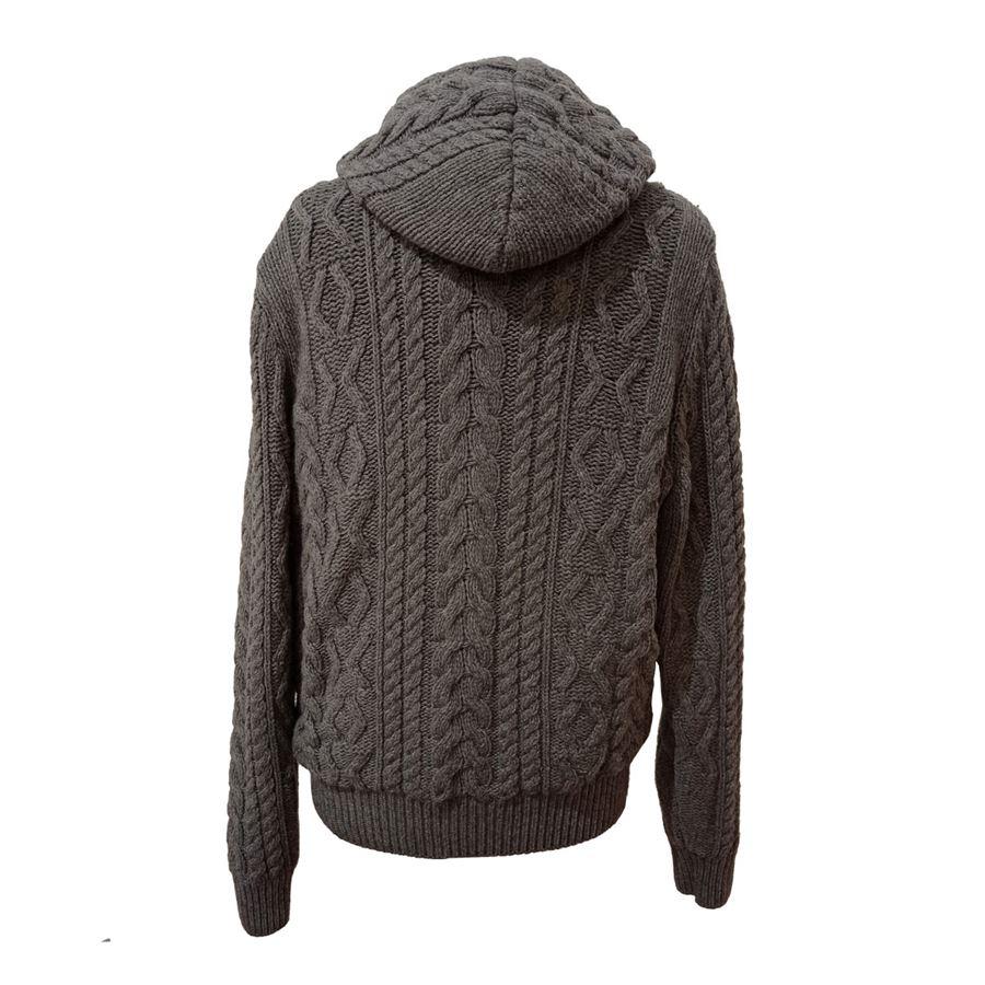 Wool (100%) Grey color Lined in brown windproof synthetic fabric Braids processing Hooded Zip closure Two pockets Length shoulder/hem cm 73 (2874 inches) Shoulder cm 43 (1692 inches)
