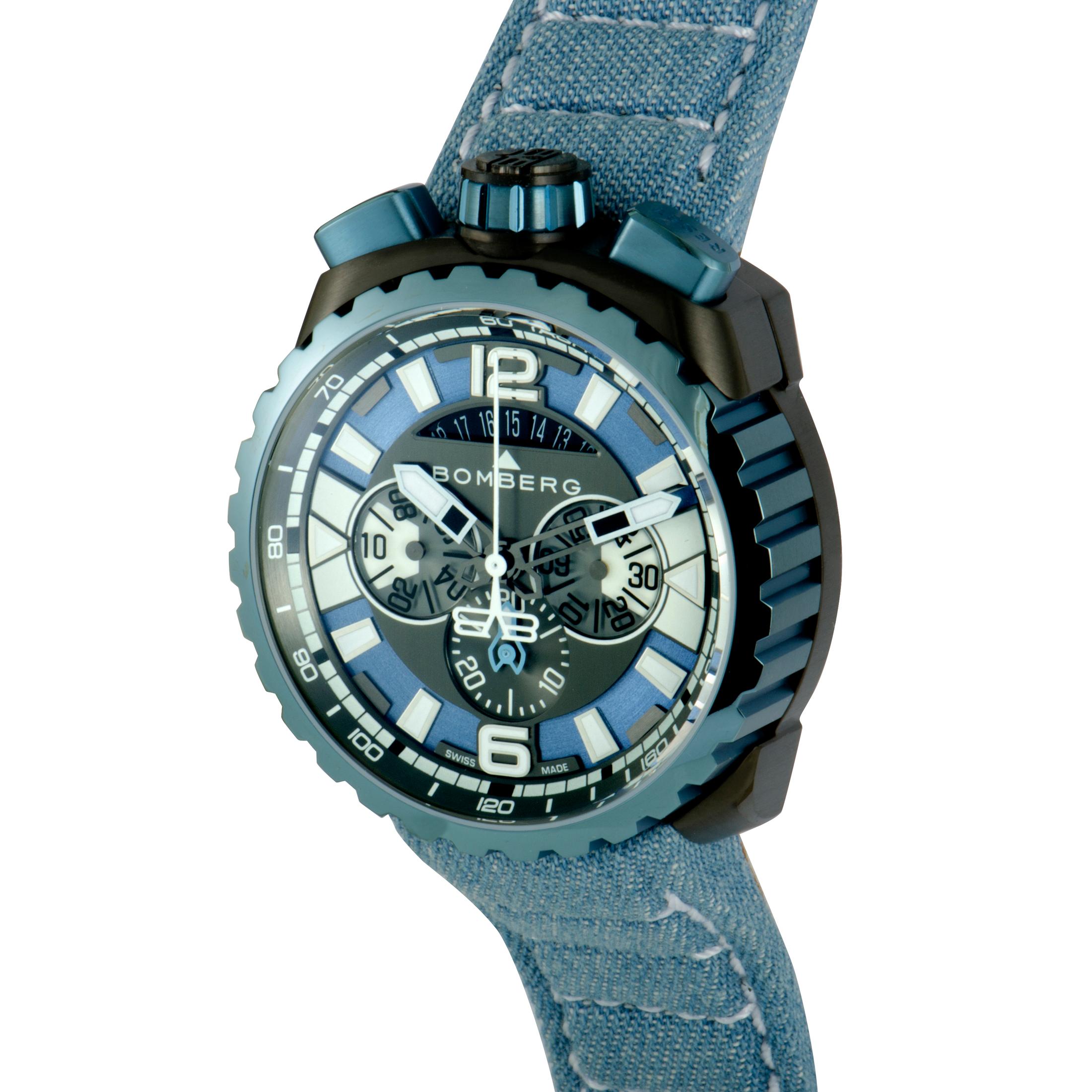 This is the Bomberg Bolt-68, reference number BS45CHPBLGM.050.

It boasts a 45 mm stainless steel case that is coated in gray and blue PVD. Powered by a quartz movement, the watch features the following functions – hours, minutes, chronograph,