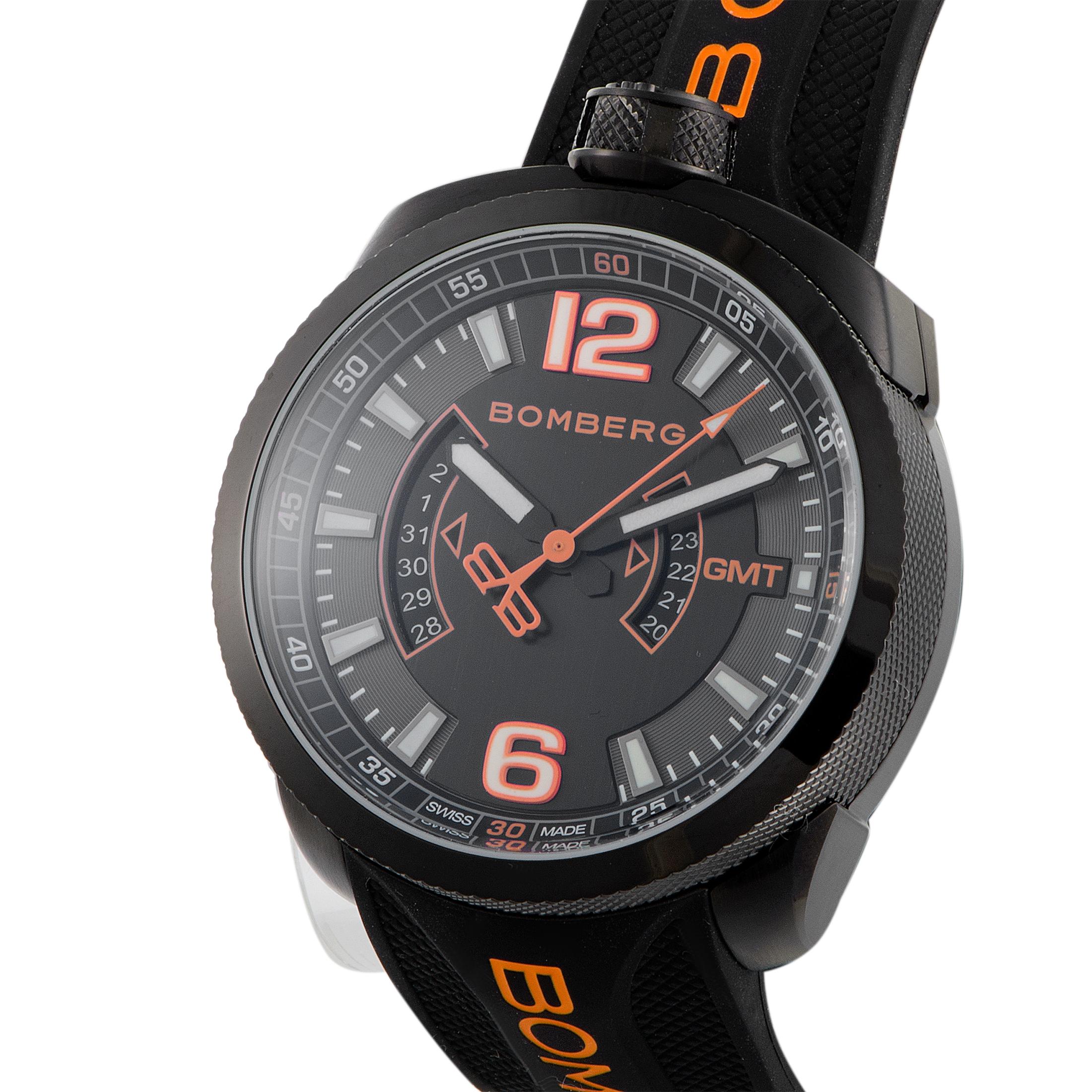 This is the Bomberg Bolt-68, reference number BS45GMTPBA.026.3.

It is presented with a 45 mm black PVD-coated stainless steel case that is mounted onto a black silicone strap fitted with a tang buckle, but can also be worn on a chain. The watch is