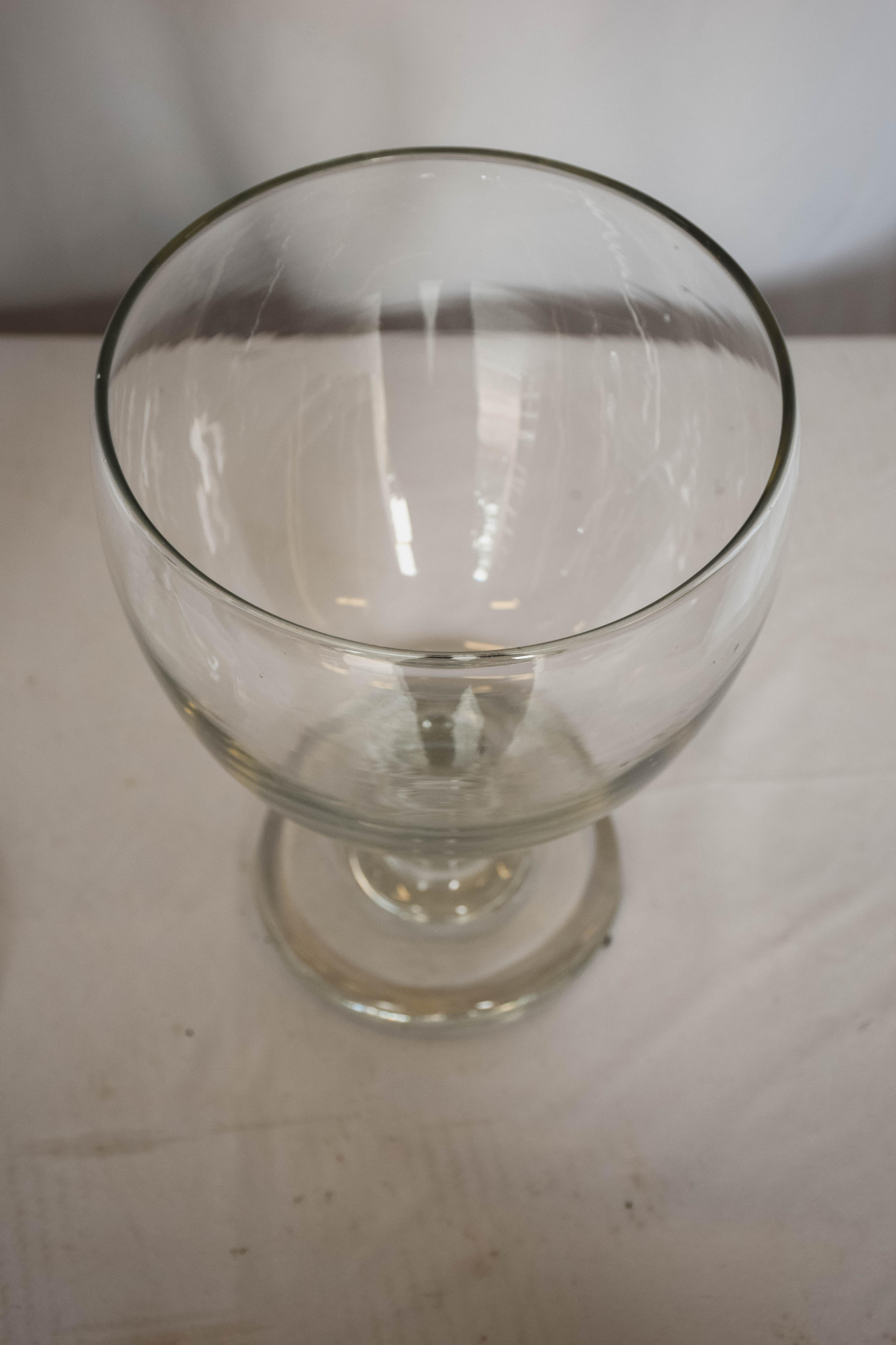 Beautiful glass candy jar with top. The top of the jar has an oval shaped beveled handle. This could be used to for macaroons, candy or your most decadent chocolate. It would also look beautiful beside a tub as a vessel for your bath salts.