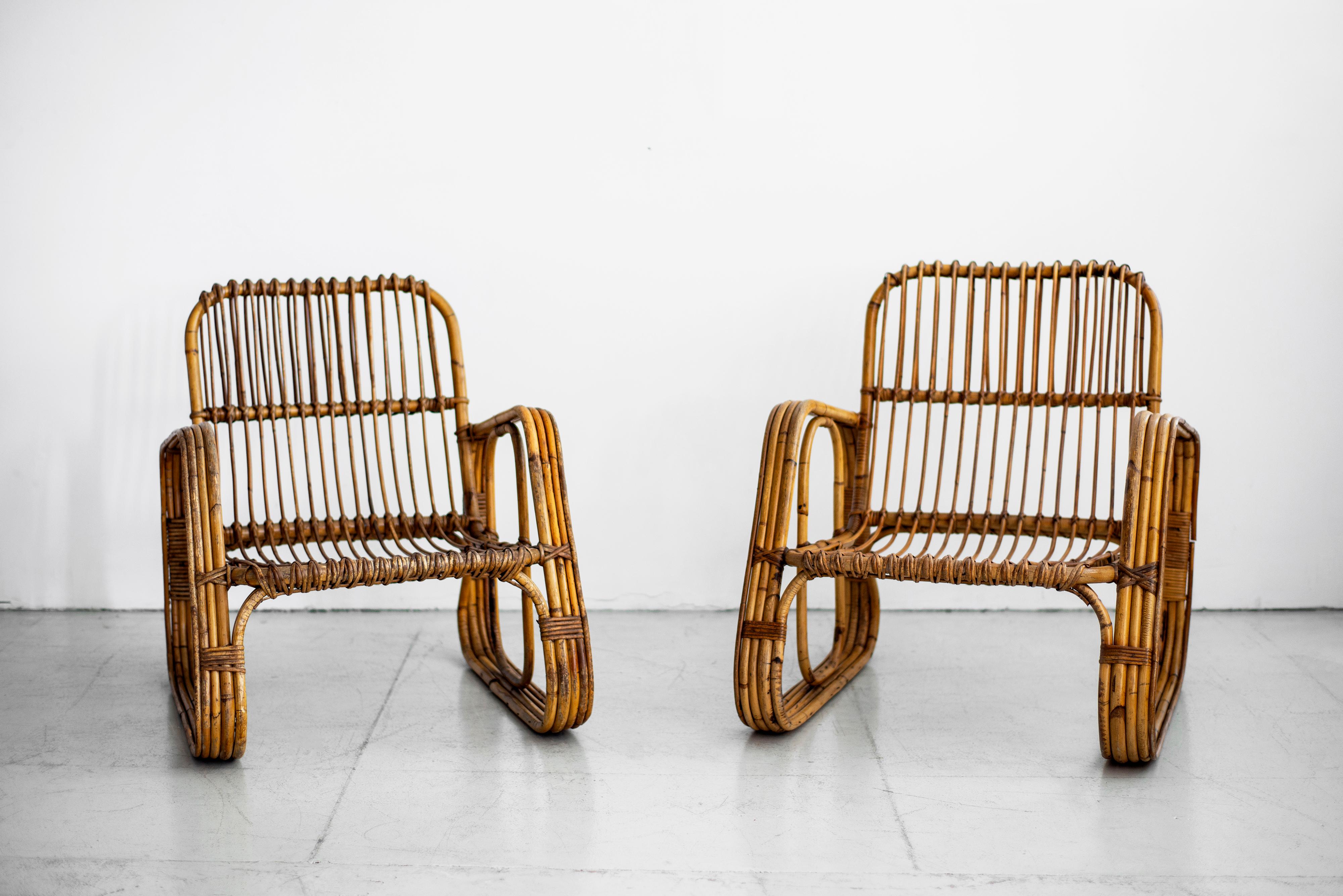 Pair of Italian rattan armchairs in the style of Bonacina with great sculptural shape. Three pairs available. Great for a hotel or restaurant! 
 