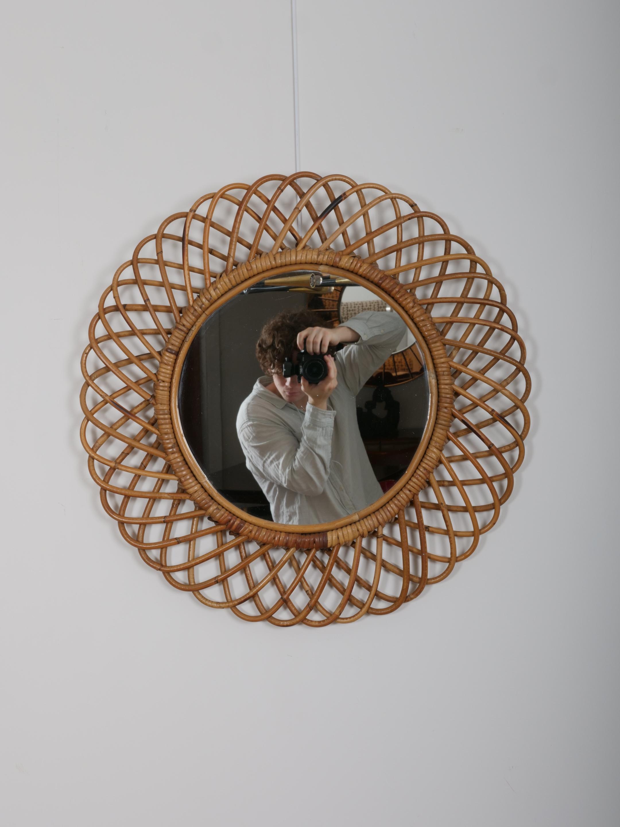 Franco Albini cane mirror.

In very good condition. 

Lovely patina to cane work and the mirror plate has very minimal signs of age. 

27