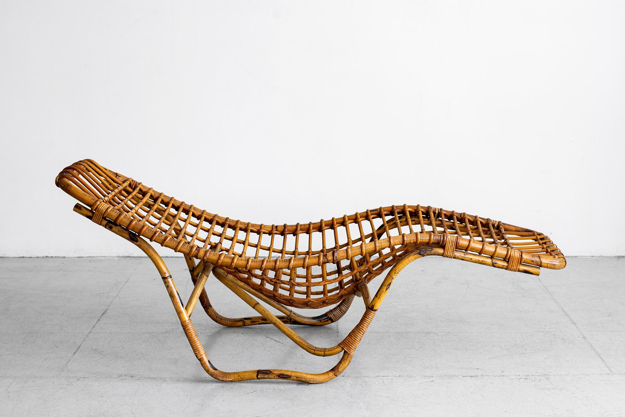 Italian rattan chaise lounge by Bonacina with sculptural form. 
 
