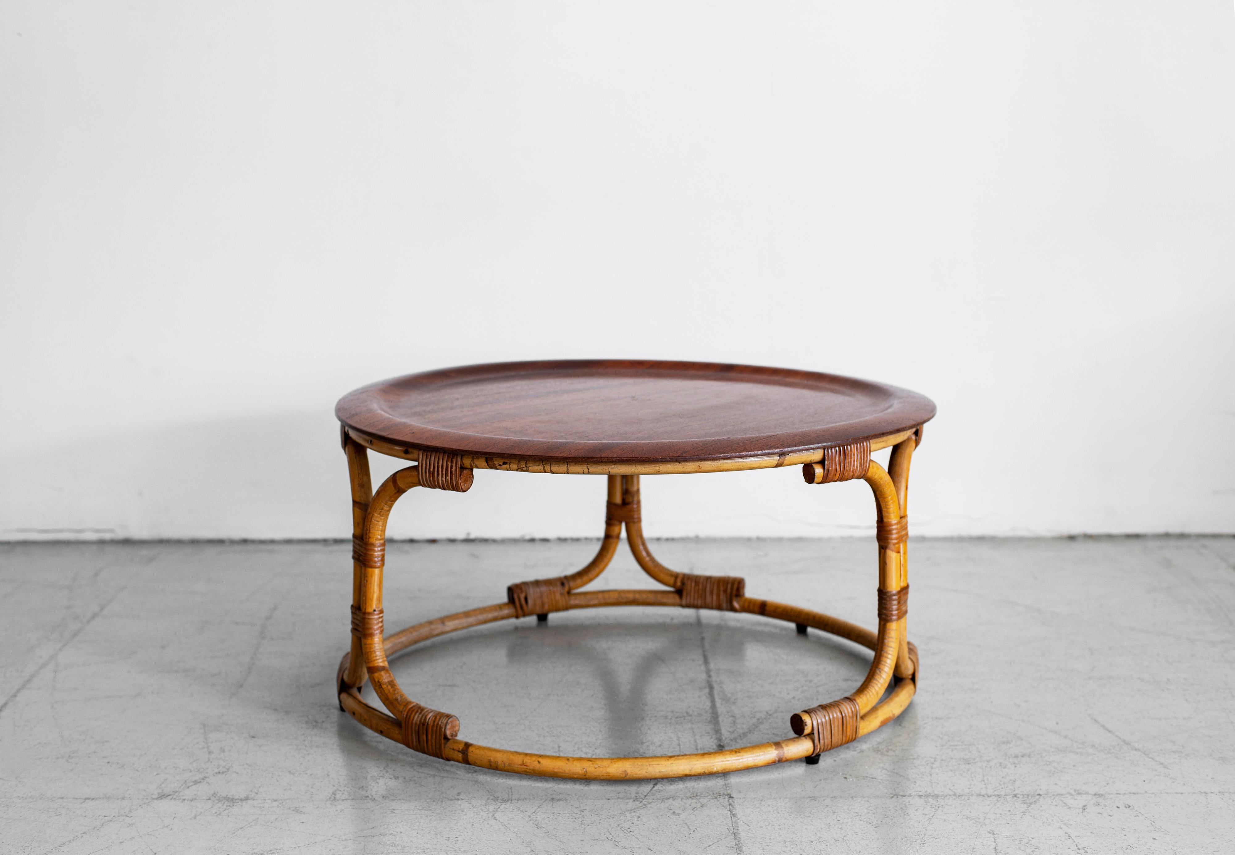 Italian coffee table by Bonacina with sculptural rattan base and circular wood top.