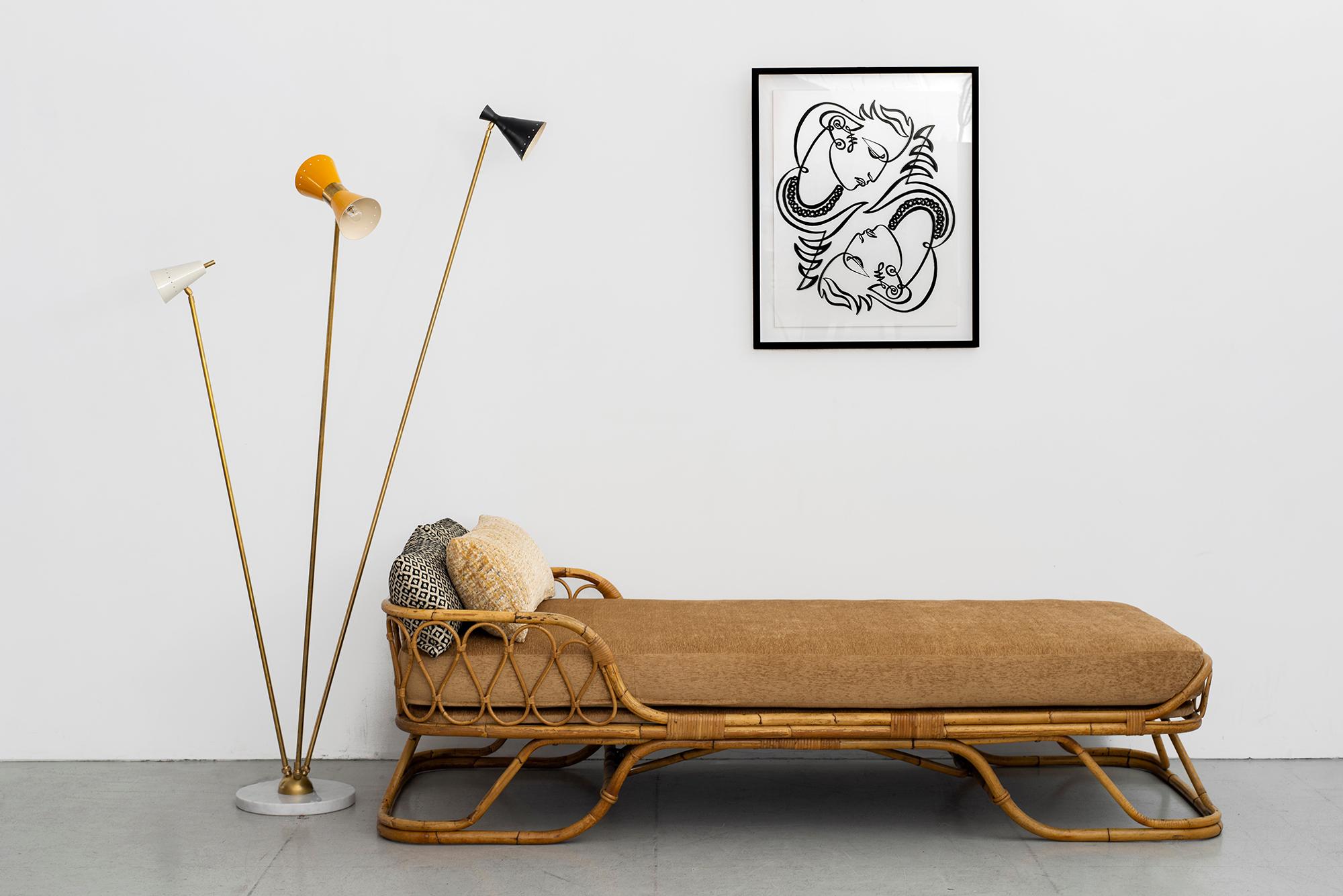 Sculptural Italian rattan daybed, newly upholstered seat cushion.
Whimsical bent rattan design on floating platform base.


Measures: W 35 1/2”
D 81 1/2”
H 22” (frame only)
H 27