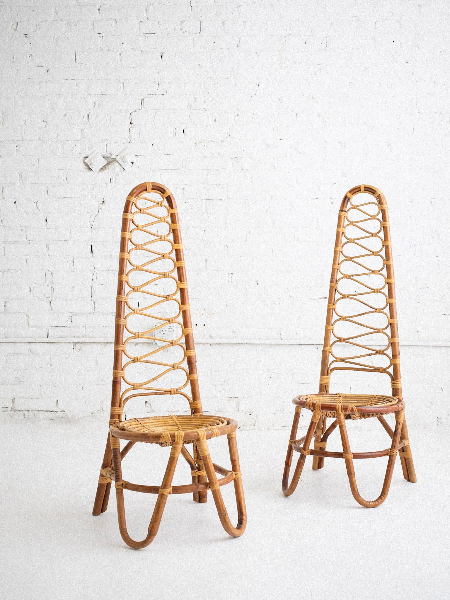 A pair of Italian mid century rattan chairs attributed to Bonacina. High back silhouette. Sourced in Northern Italy. New wool boucle cushions included. Cushions add 2.5” to seat height.

Bonacina is a renowned Italian furniture company, established
