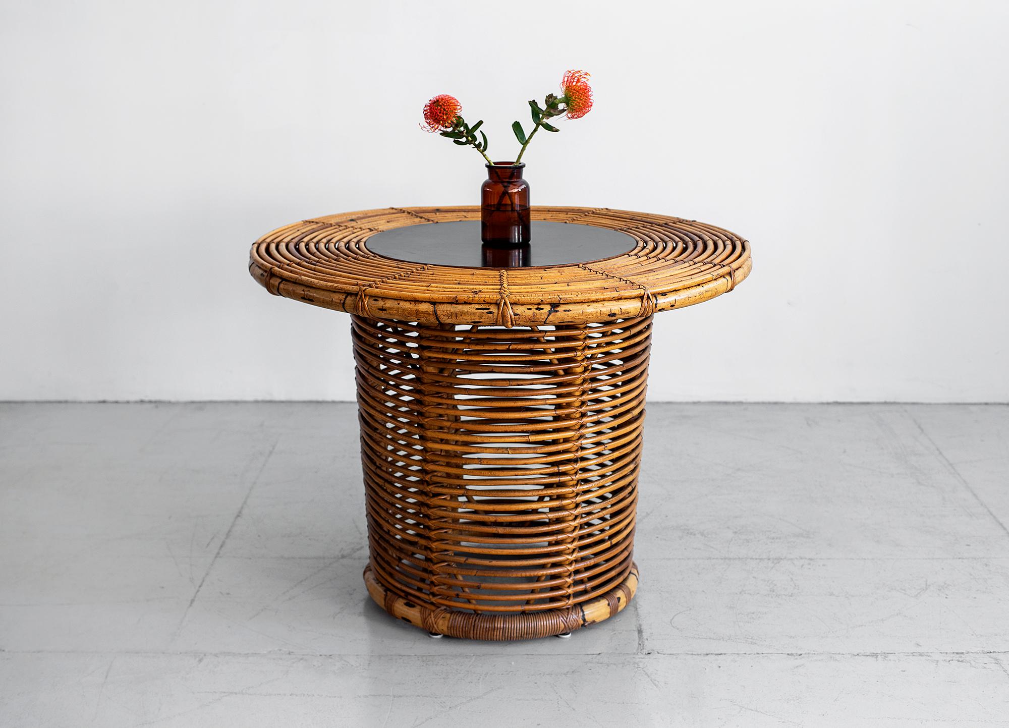 Circular Italian rattan table by Bonacina
Laminated wood centrepiece.