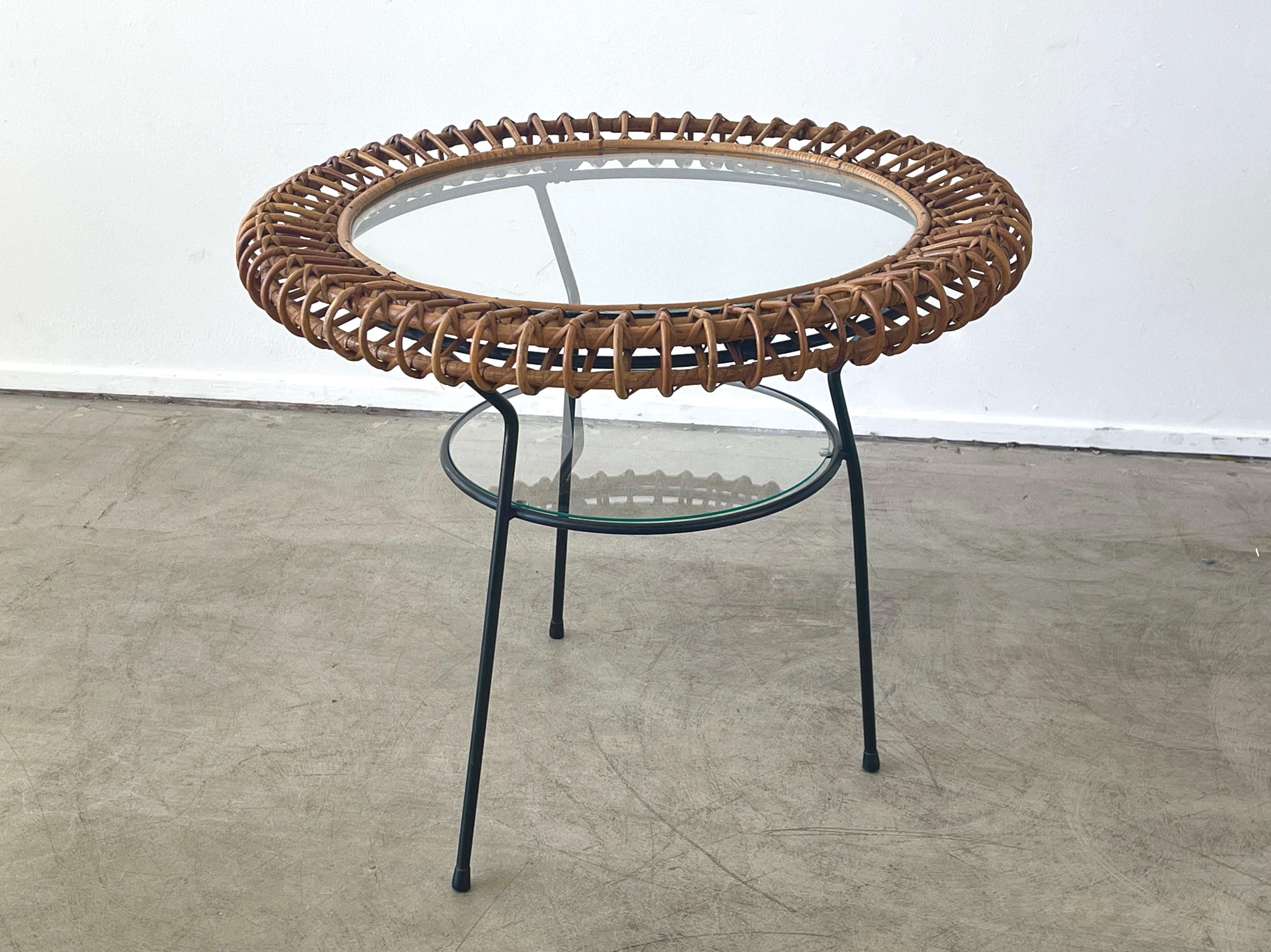 Bonacina side table with iron frame and circular bamboo top. 
2 Tiers of glass.