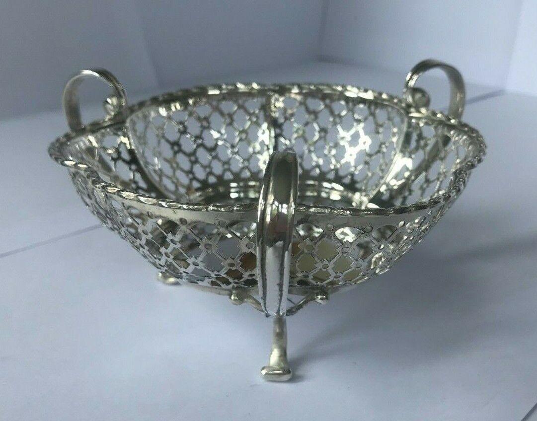 Sterling Silver Bonbon Dish Made by Synyer & Beddoes in 1910

In excellent condition, this is a beautiful piece with a reticulated/pierced decorated body. The body has a melon shape with six wide scalloped reticulated panels and a solid base.The