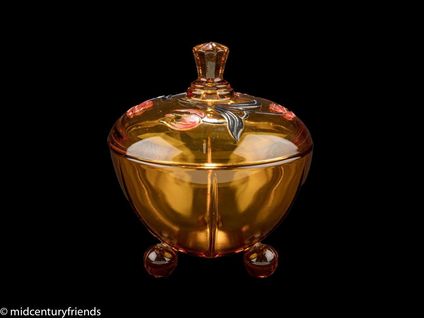 Charming bonbonniére from the 1930s. Well-shaped glass jar in shades of brown with three tulips on the lid. 