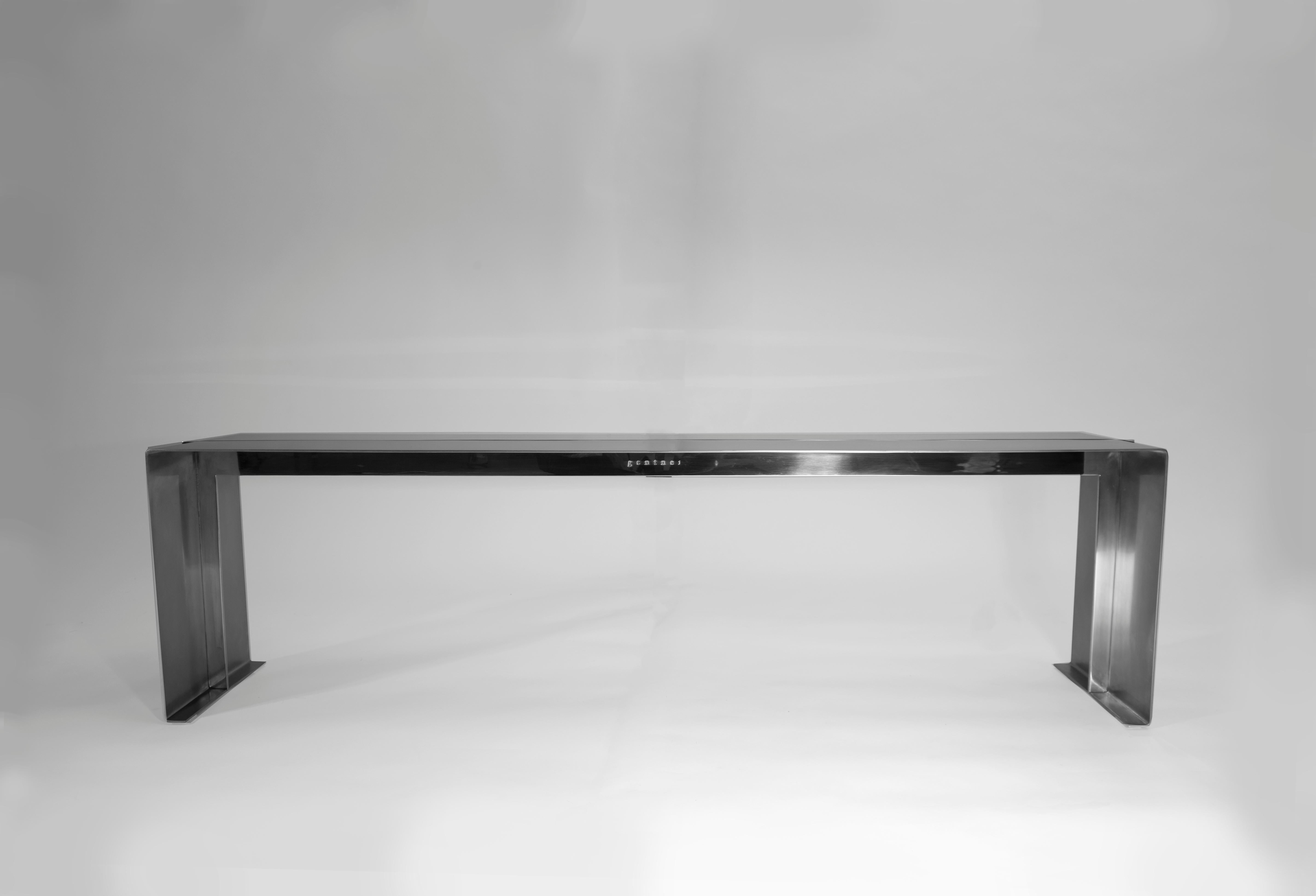 Bond bench by Gentner Design
Dimensions: D 152 x W 35.5 x H 45.7 cm
Materials: stainless steel

A subtle mix of polished and brushed stainless steel, this bench is about attention to detail. The simple T-shape structure is simplicity at its best