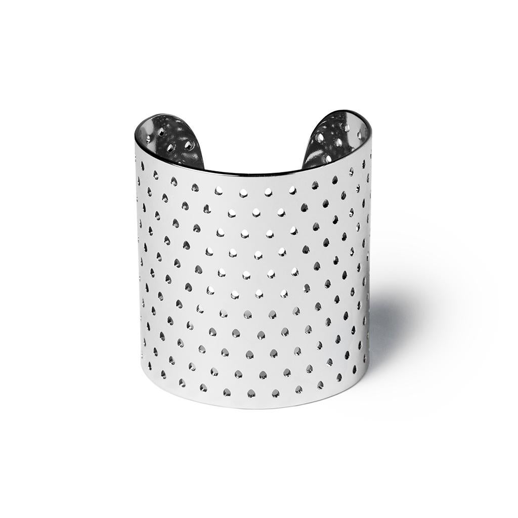 Perforated metal cuff bracelet with open in back for adjustable fit, high polish finish, and exterior logo detail. Wear individually, or as a set. Made by BOND HARDWARE.

BOND Hardware is a sustainable jewelry and accessories label, designed and