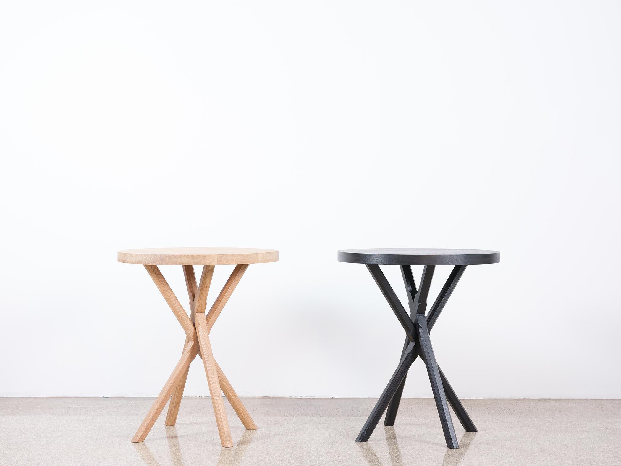 This modern x-based side table is hand made in the United States and features all-hardwood construction. Characterized by a thick solid wood top,  and intricately carved polygonal legs, the modern Bond Side Table is distinguished by its dual