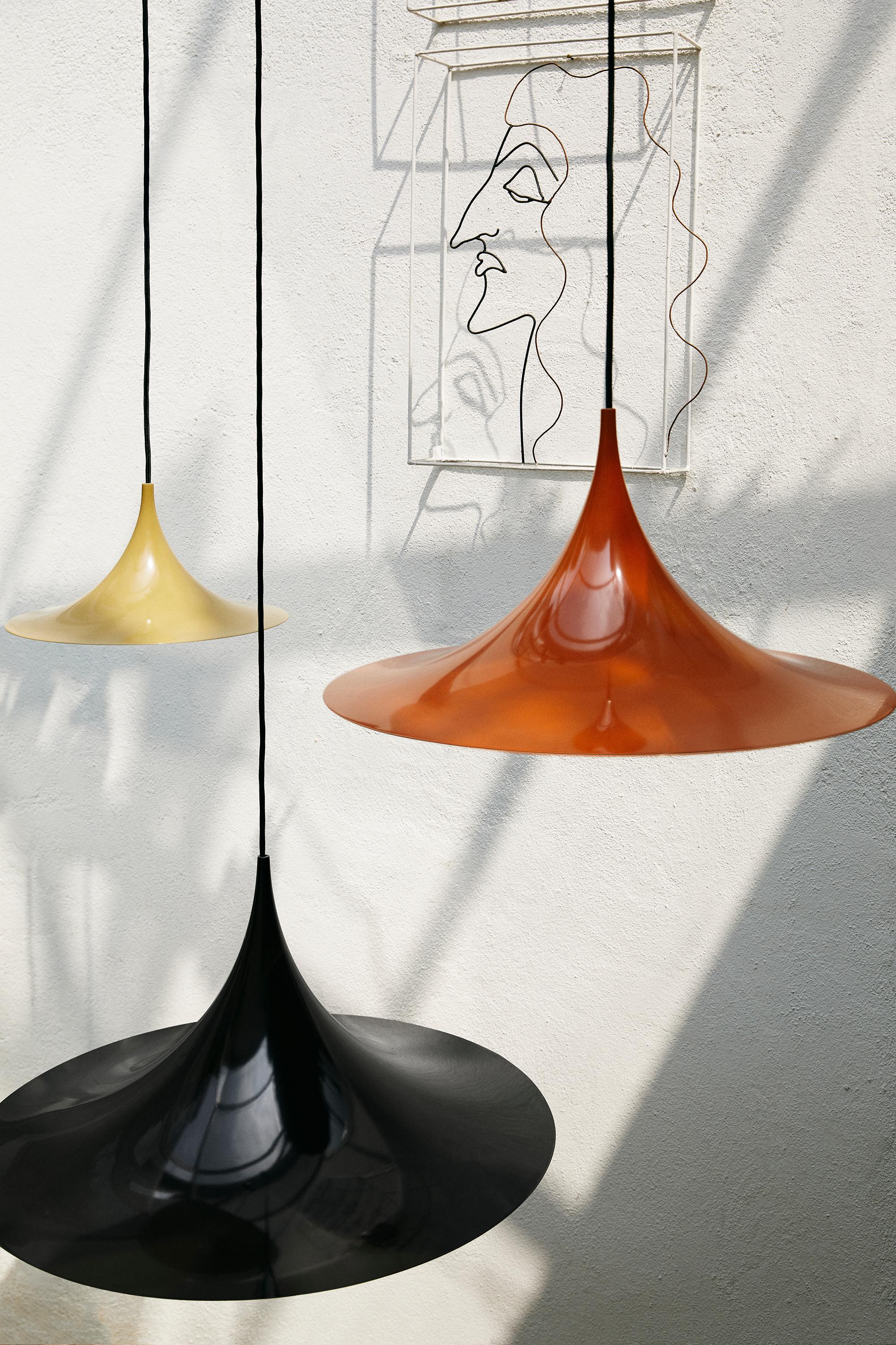 Bonderup And Thorup 'Semi' Pendant in Dark Cocoa.

Designed in 1968 by Claus Bonderup and Torsten Thorup, this authorized re-edition by GUBI of Denmark meticulously reproduces their work with great attention to detail and materials faithful to the