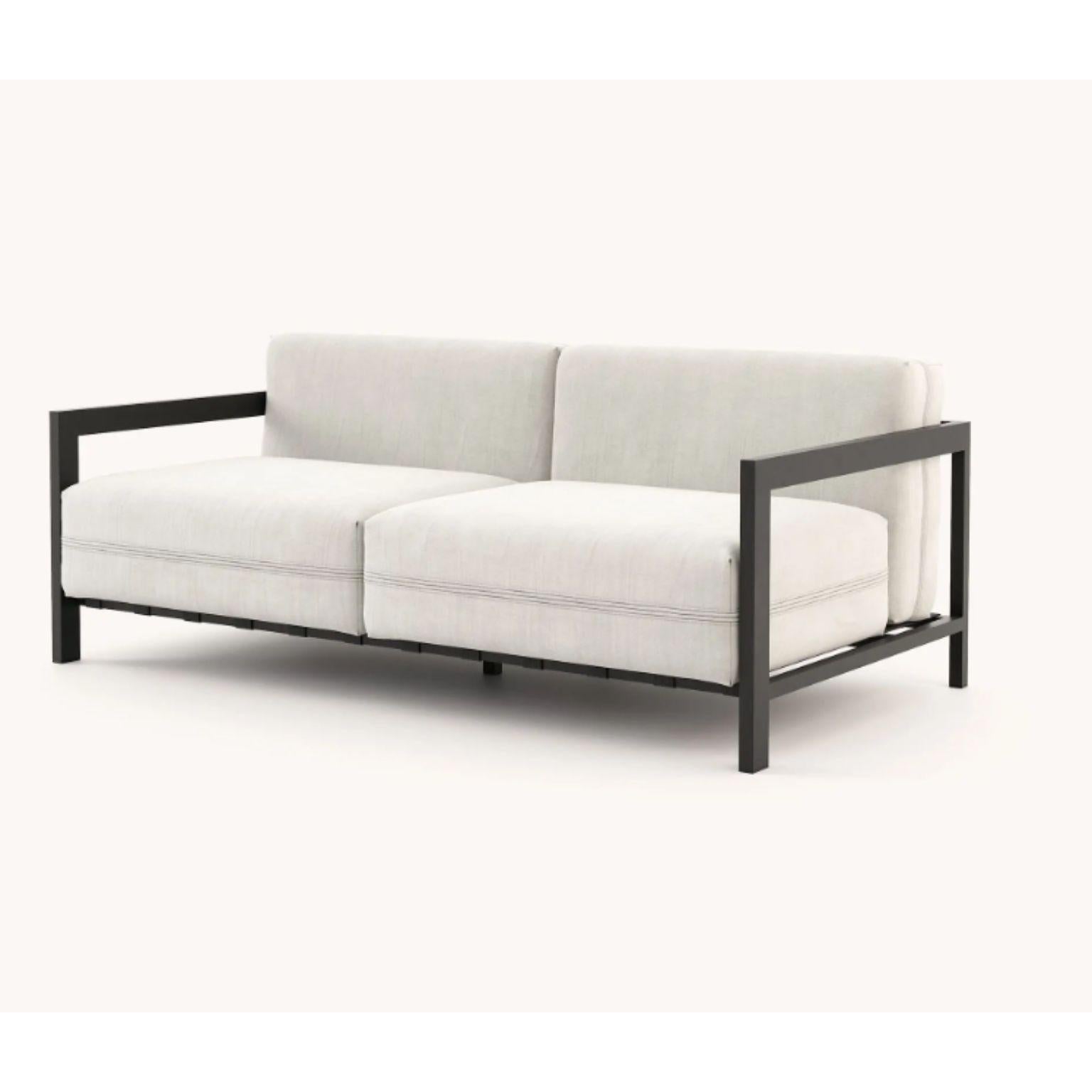Bondi 2 seats sofa by Domkapa.
Materials: black texturized stainless steel, fiber (Drava Nata).
Dimensions: W 182 x D 95 x H 72 cm.
Also available in different materials. 

The clean aesthetic gives an organic shape and a pleasing design to the