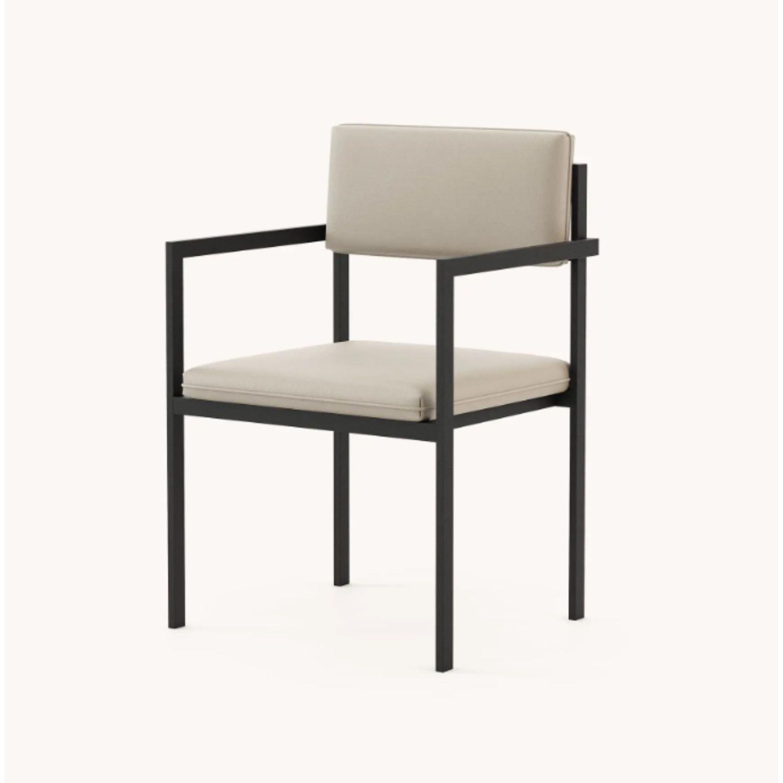 Bondi chair with armrest by Domkapa
Materials: black texturized steel, fabric (Nile Ivory).
Dimensions: W 48 x D 50 x H 86 cm.
Also available in different materials. 

Bondi Chair reflects a special lifestyle collection characterized by organic