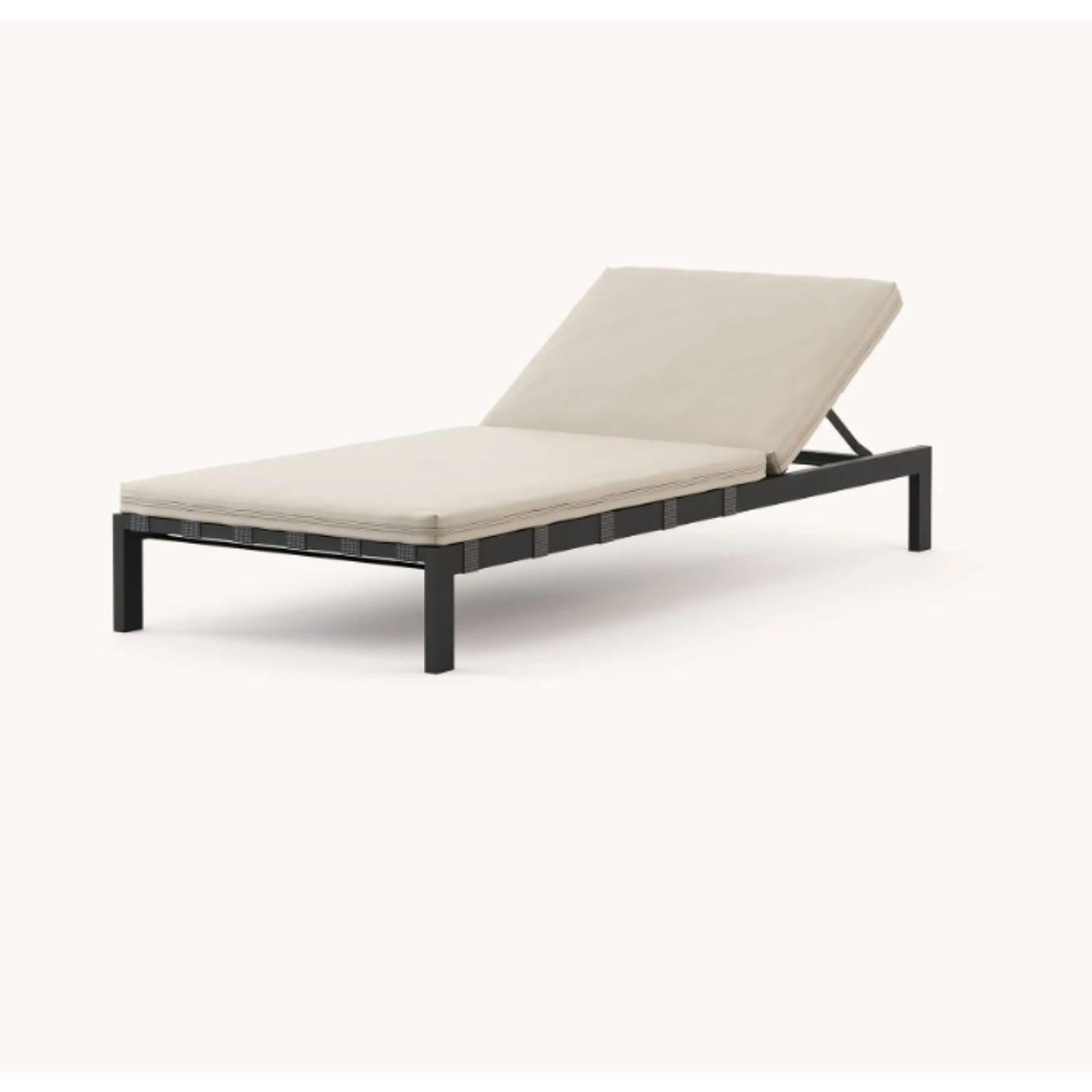 Bondi lounger by Domkapa
Materials: black texturized steel, fabric (Nile Ivory).
Dimensions: W 200 x D 81 x H 31.5 cm.
Also available in different materials.

Enjoy your outdoor space with Bondi Lounger and your summers will never be the same.