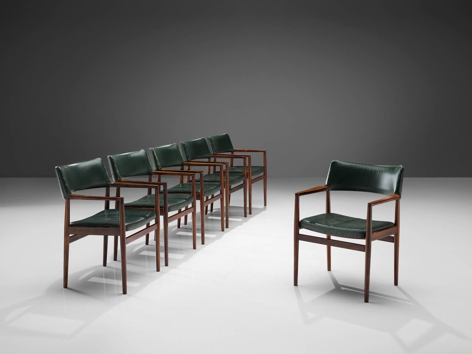 Bondo Gravesen, set of 6 armchairs, leather and rosewood, Denmark, 1960s

Classic armchairs designed by Bondo Gravesen. The chairs maintain the original dark green leather, which is in fair condition with a rich patina. The lacquered rosewood and