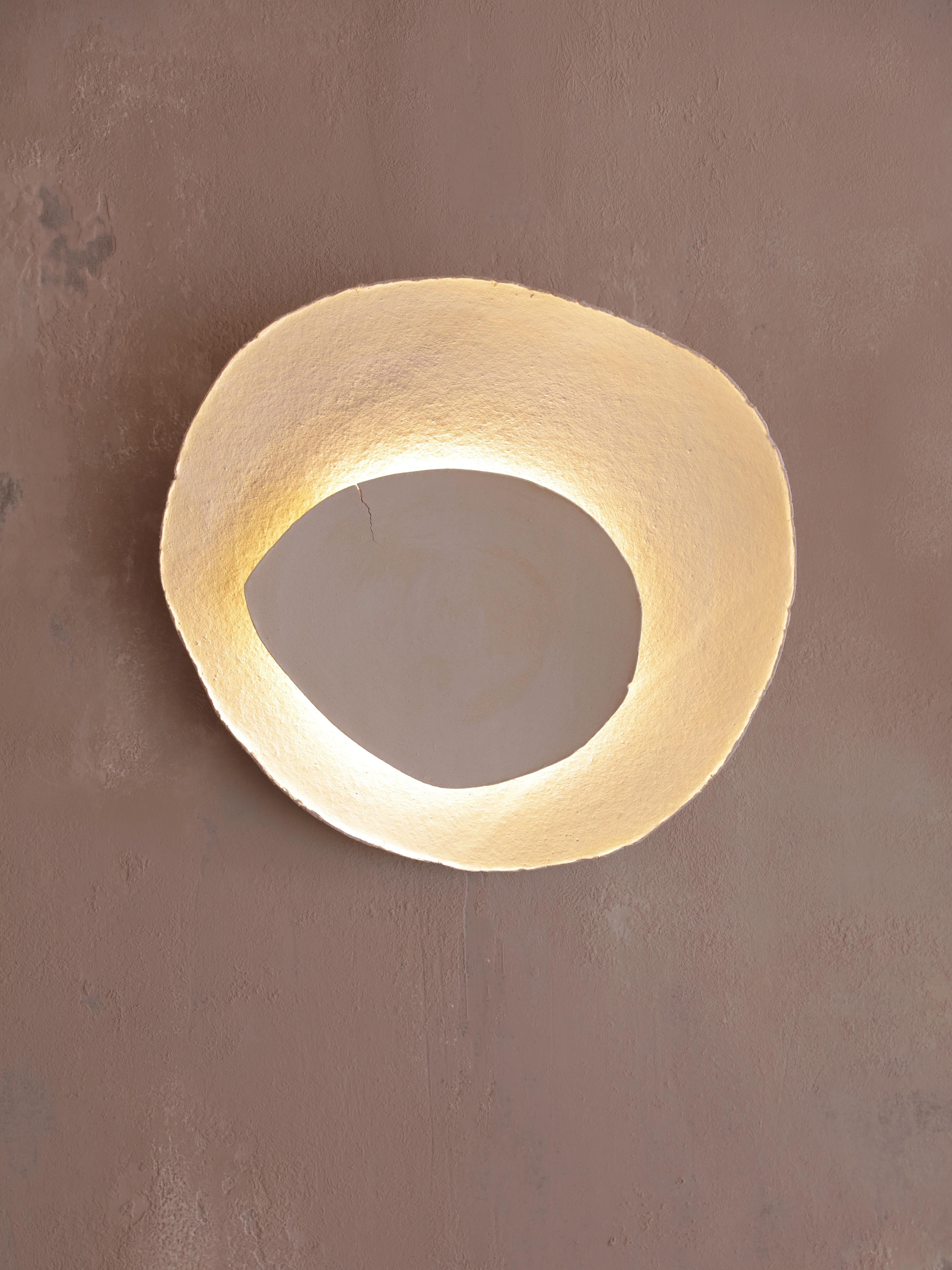 Bone #12 wall light by Margaux Leycuras
One of a Kind, Signed and numbered
Dimensions: D 6 x W 44 x H 39cm 
Material: Ceramic, sand stoneware tops with a porcelain engobe finish.
The piece is signed, numbered and delivered with a certificate of