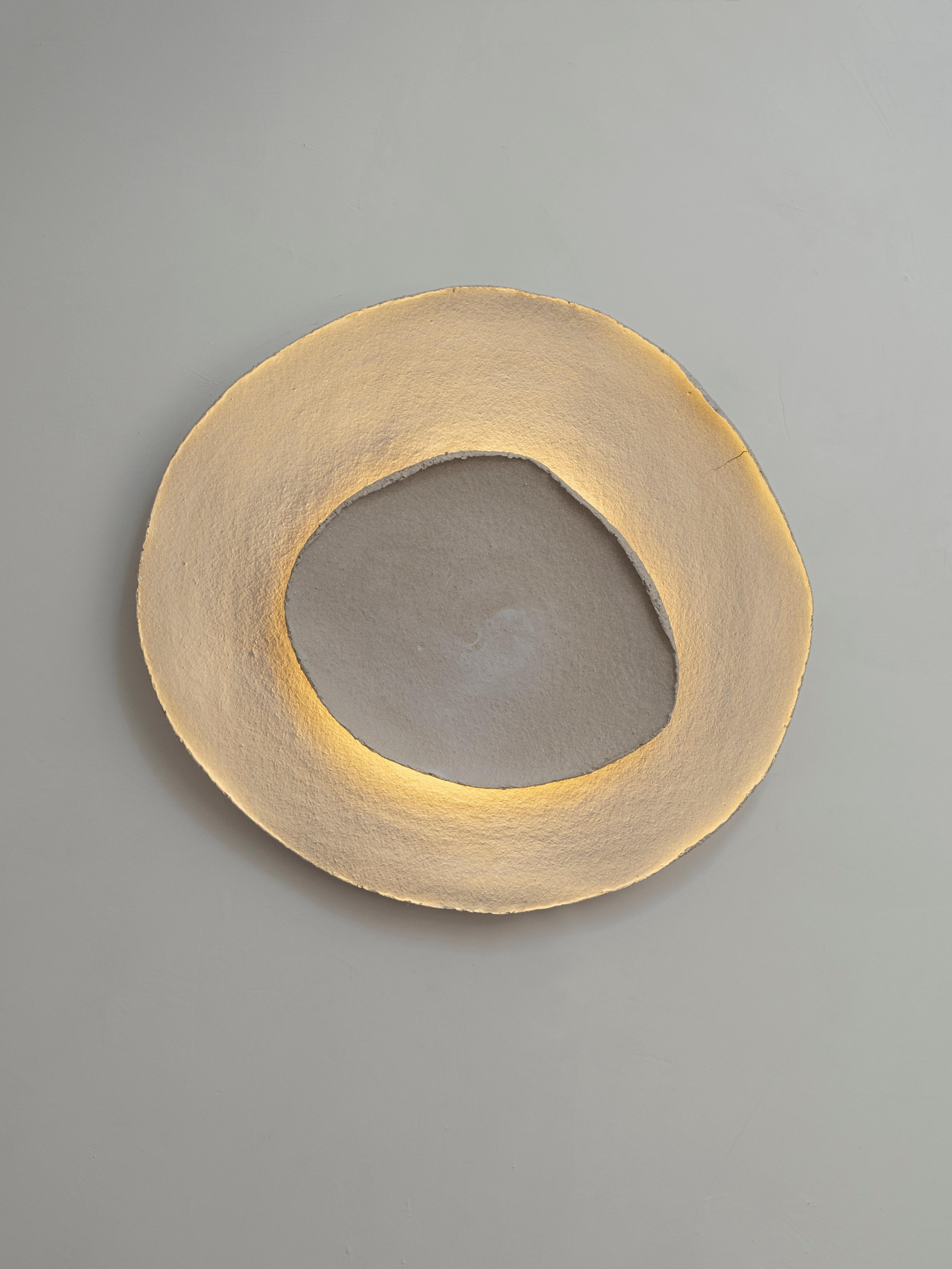 Bone #17 wall light by Margaux Leycuras
One of a Kind, Signed and numbered
Dimensions: Ø58, H54 cm 
Material: Ceramic, sand stoneware tops with a porcelain engobe finish.
The piece is signed, numbered and delivered with a certificate of