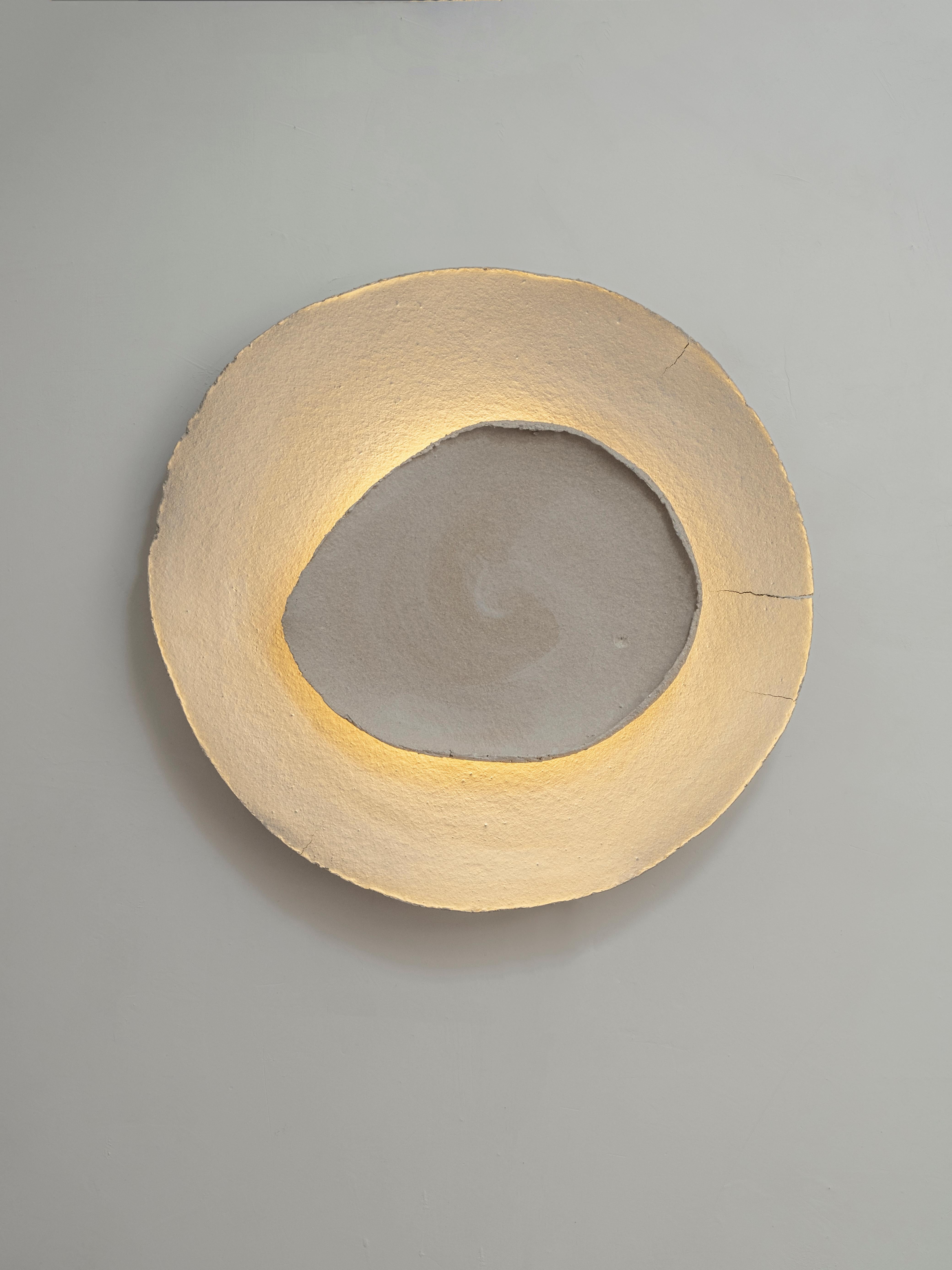 Bone #18 wall light by Margaux Leycuras.
One of a Kind, Signed and numbered.
Dimensions: Ø56 cm.
Material: Ceramic, sand stoneware tops with a porcelain engobe finish.
The piece is signed, numbered and delivered with a certificate of