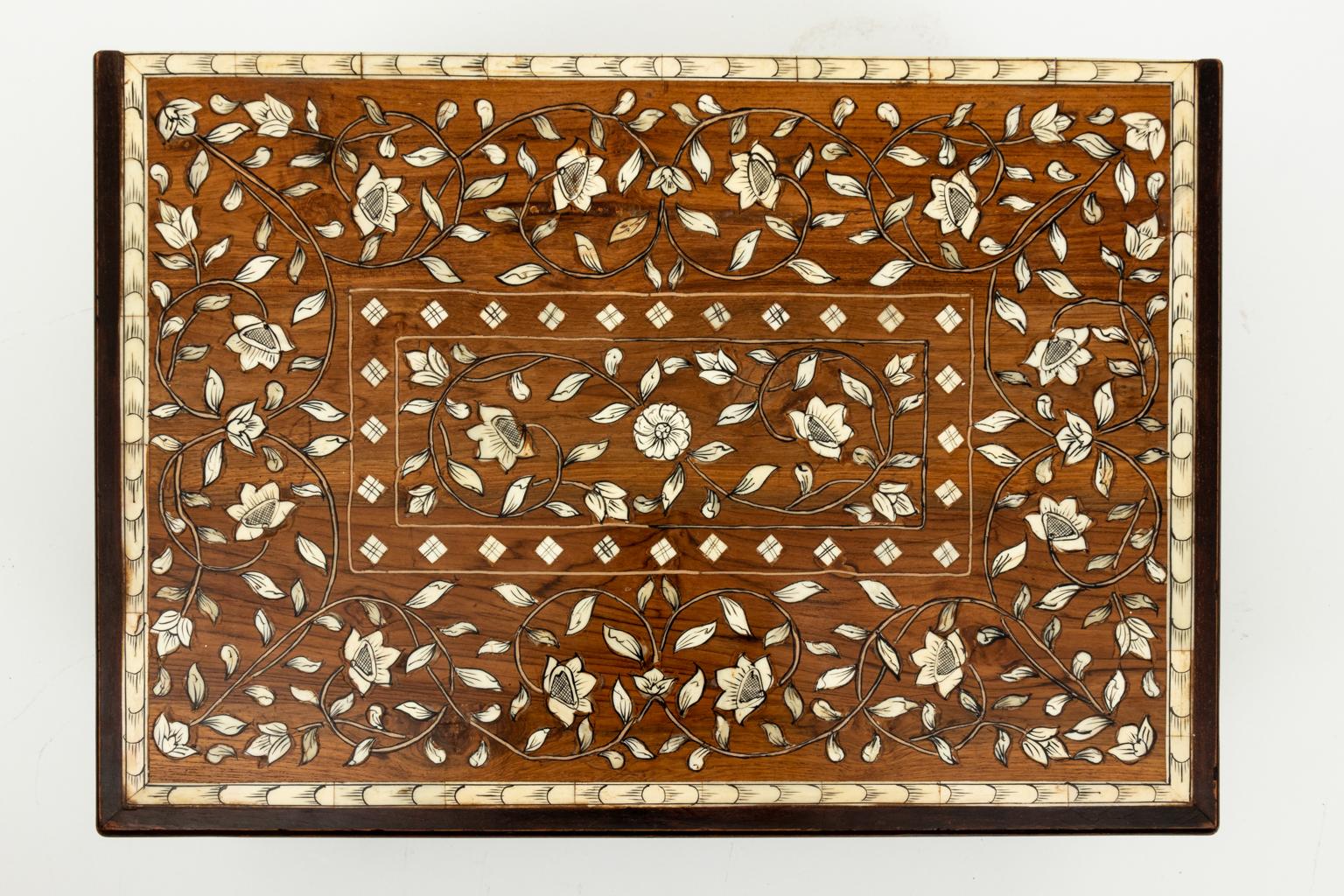 Bone and teakwood inlaid box decorated with flower pattern throughout. Please note of wear consistent with age including minor finish loss.